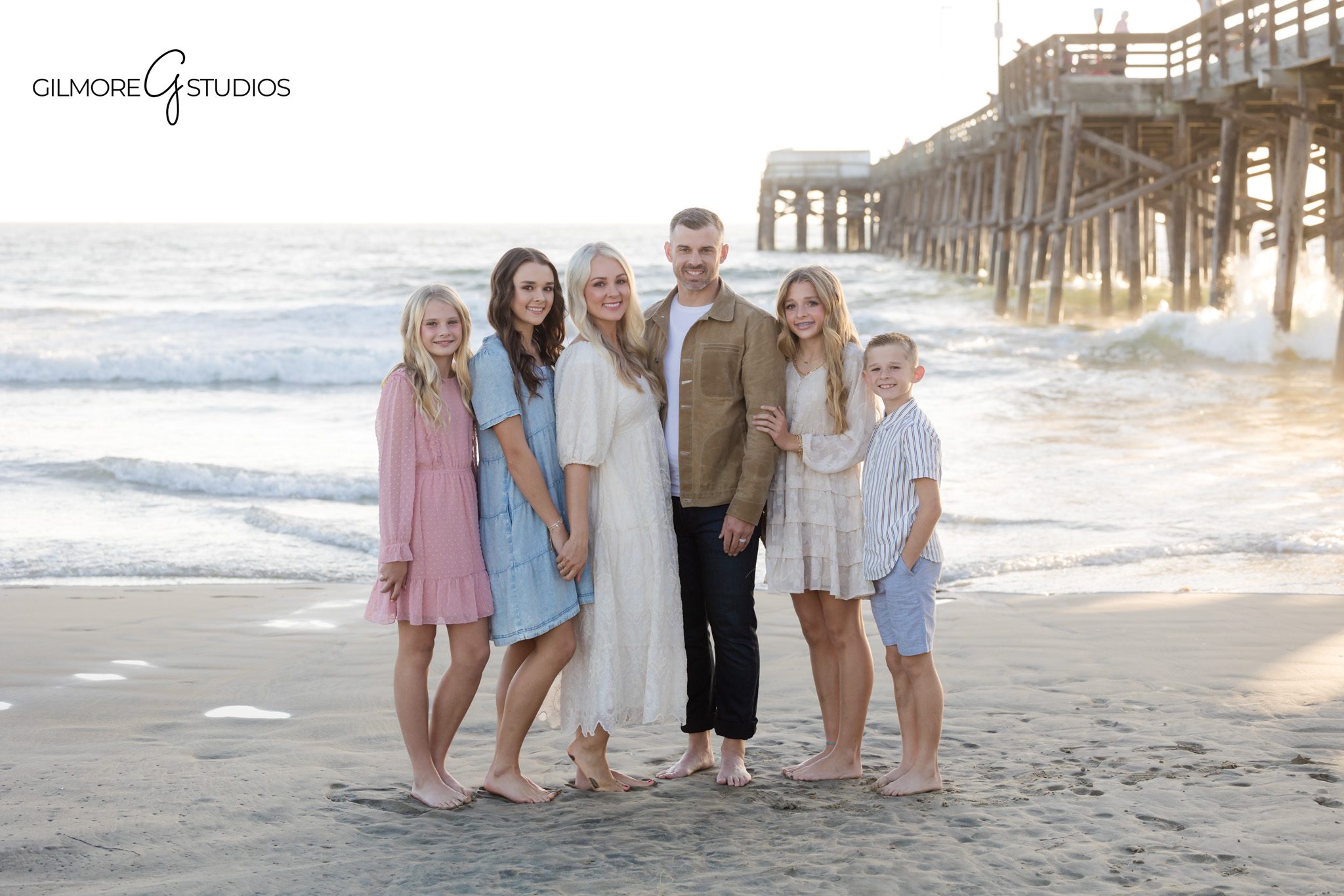 Coastal family photographer Newport Beach portrait session under the pier

Newport Beach mini session family photography with playful candid portrait