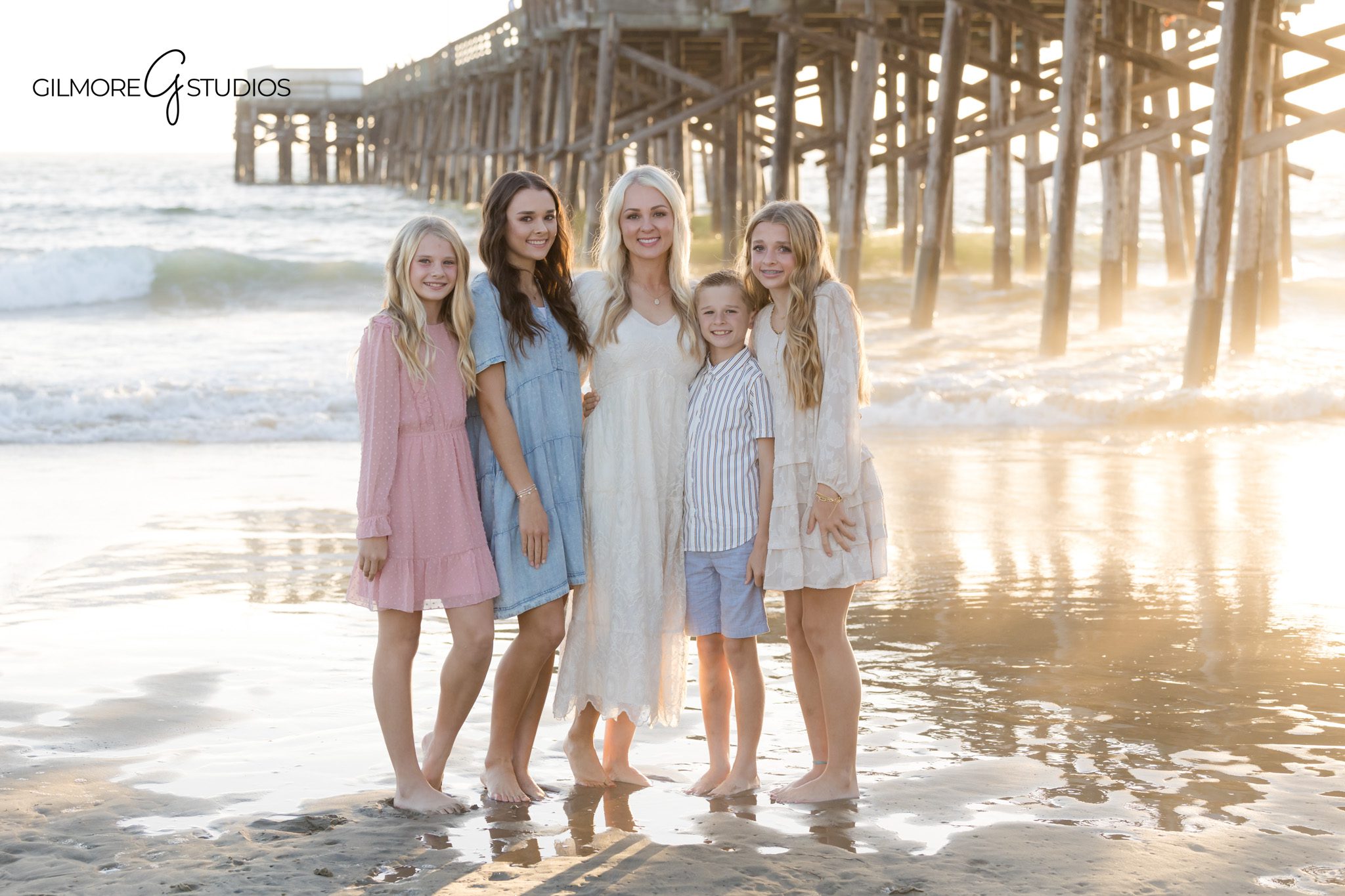 Family mini session portrait with Newport Beach Pier and glowing sunset

Orange County photographer Newport Beach Pier family mini portrait session