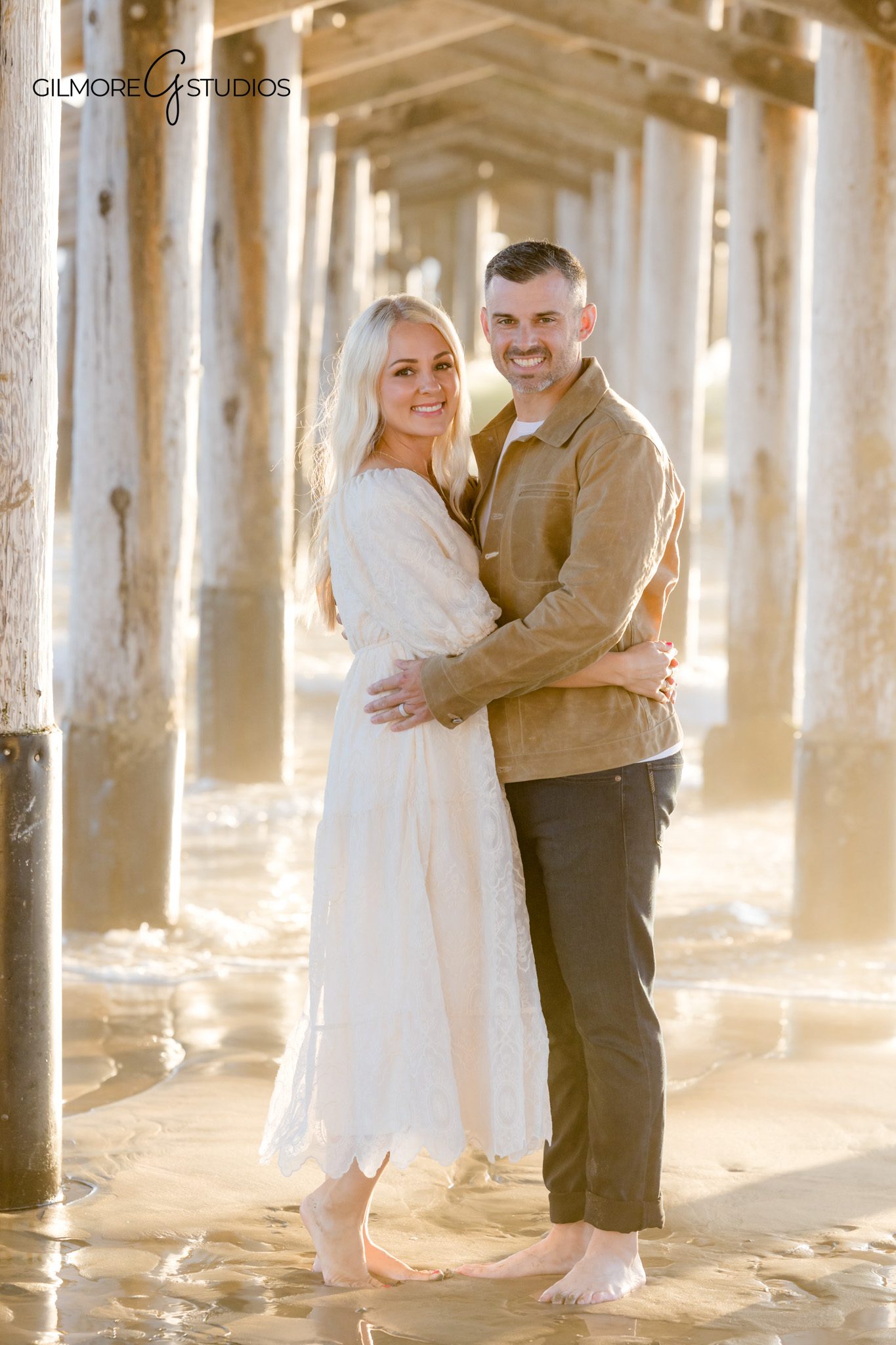 Beach mini session photographer in Newport Beach creating timeless family portrait

Newport Beach Pier family portrait photography of toddler smiling at camera