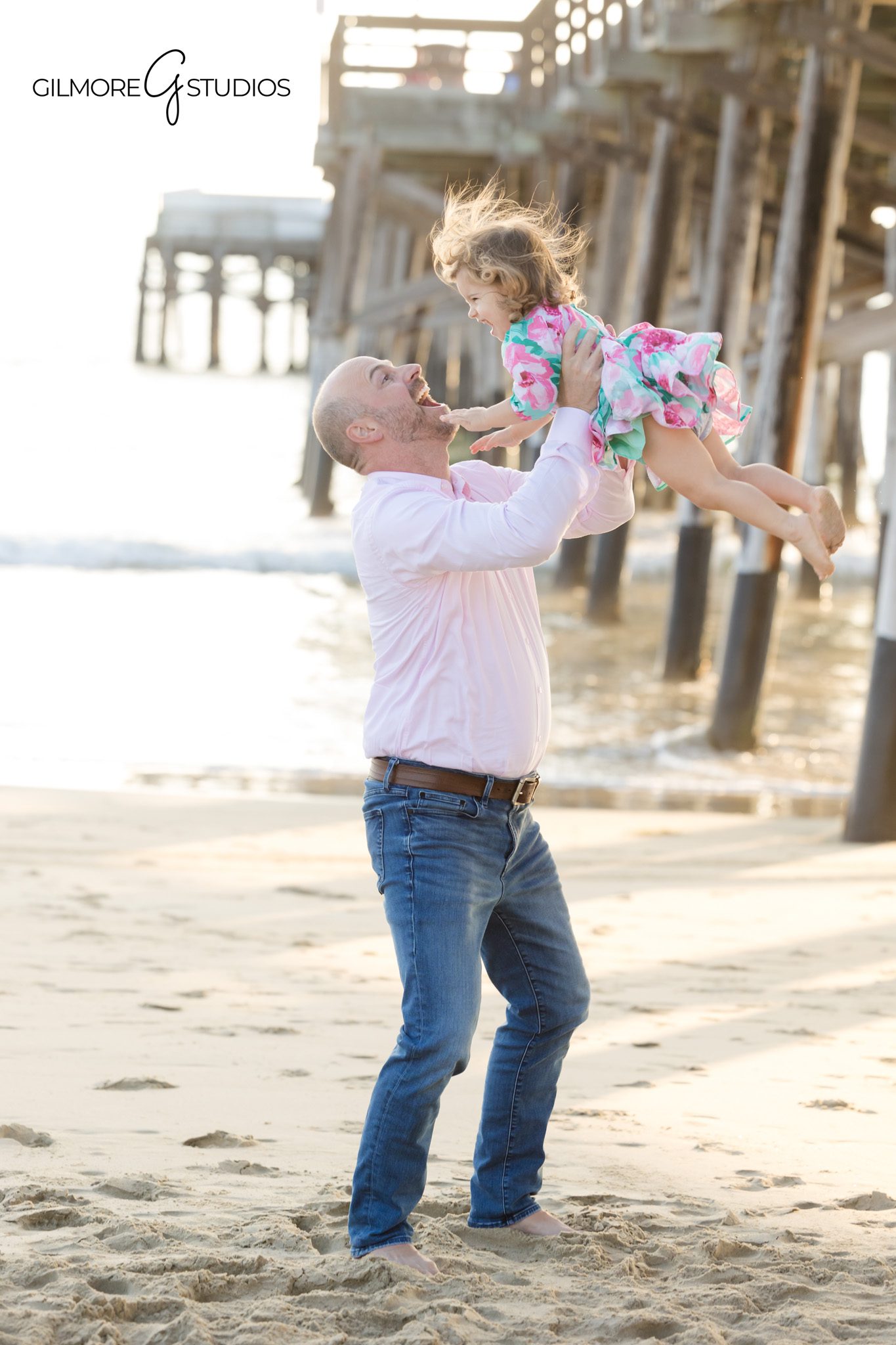 Family portrait photography with soft ocean light under Newport Pier.

Newport Pier photographer capturing toddler birthday milestone photos.