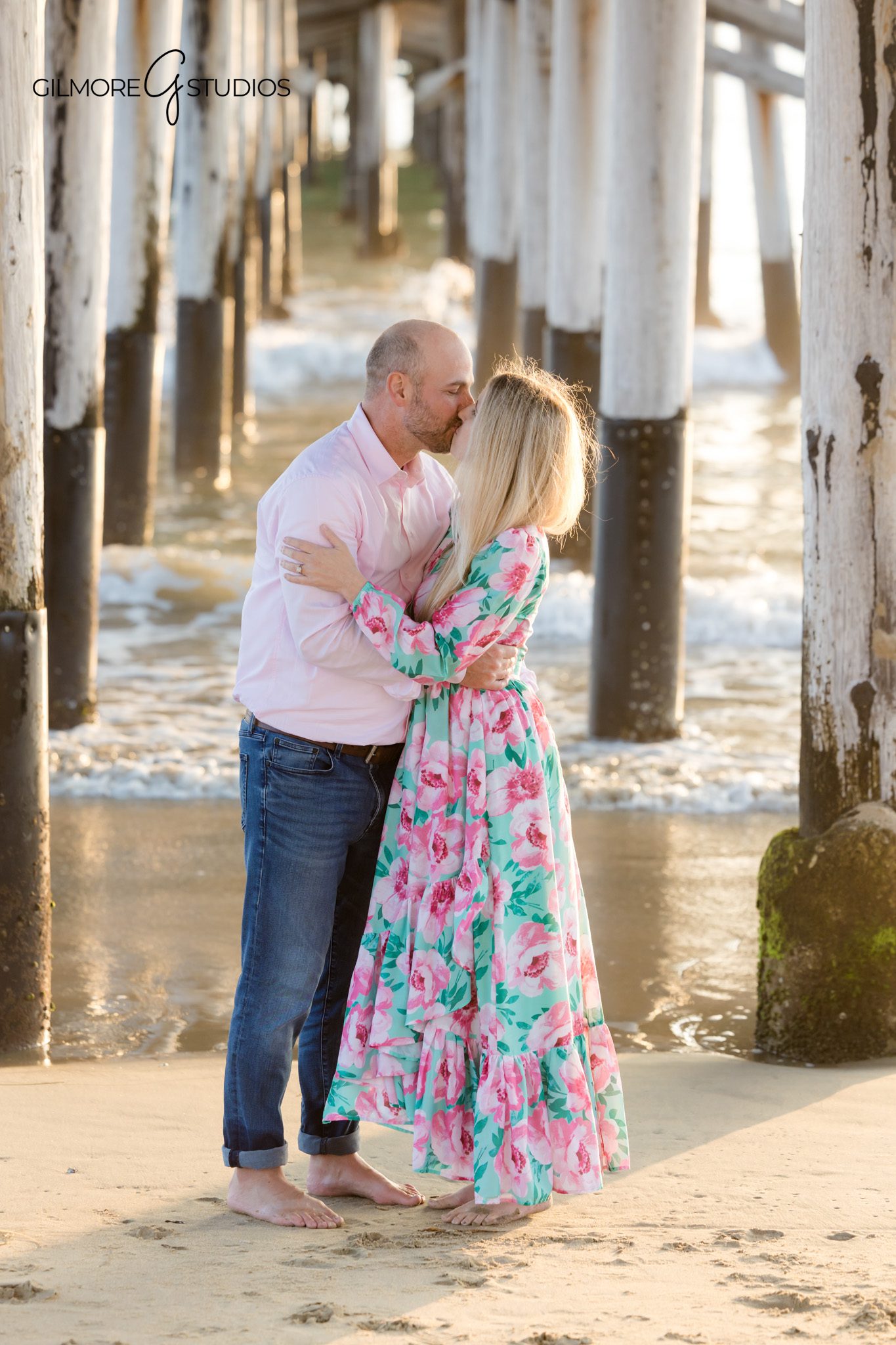 Beach photography of toddler exploring sand at Newport Pier.

Newport Pier photographer documenting family snuggles at sunset.
