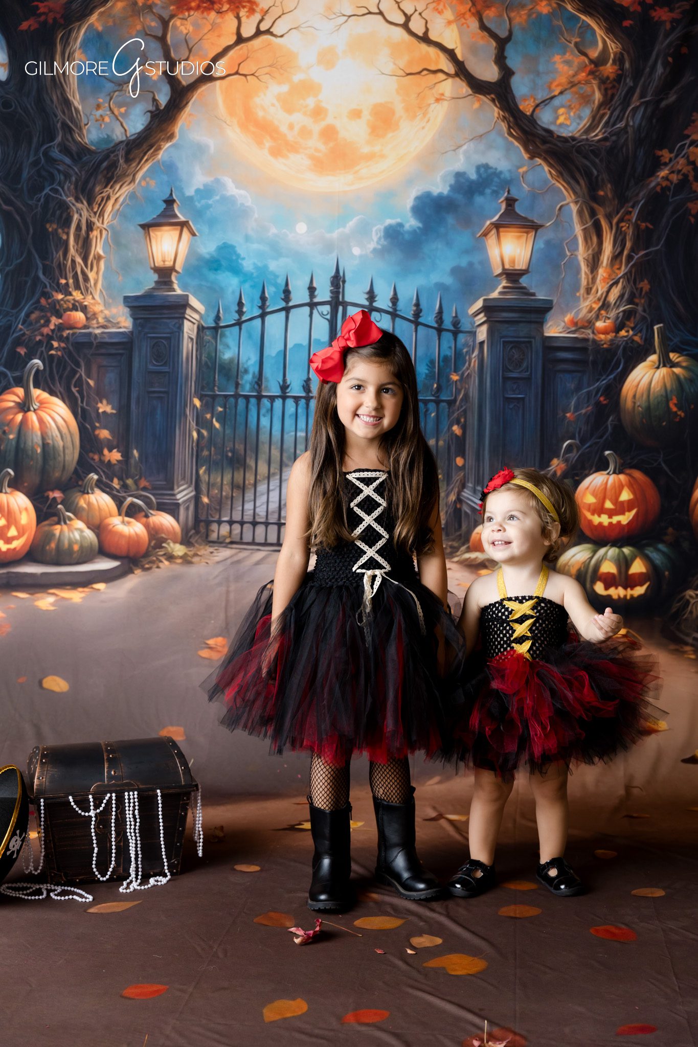 Professional photographer capturing Halloween family portraits in studio
Halloween mini session photography designed for timeless keepsakes