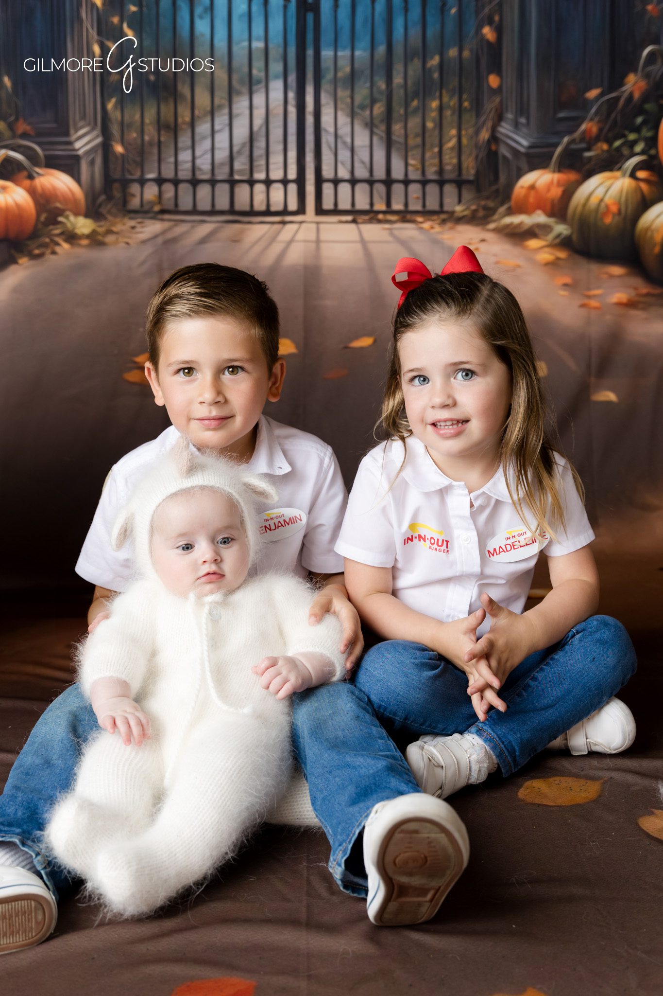 Halloween photography minis showcasing children dressed in seasonal costumes
Client appreciation portrait photography featuring Halloween themed backdrop