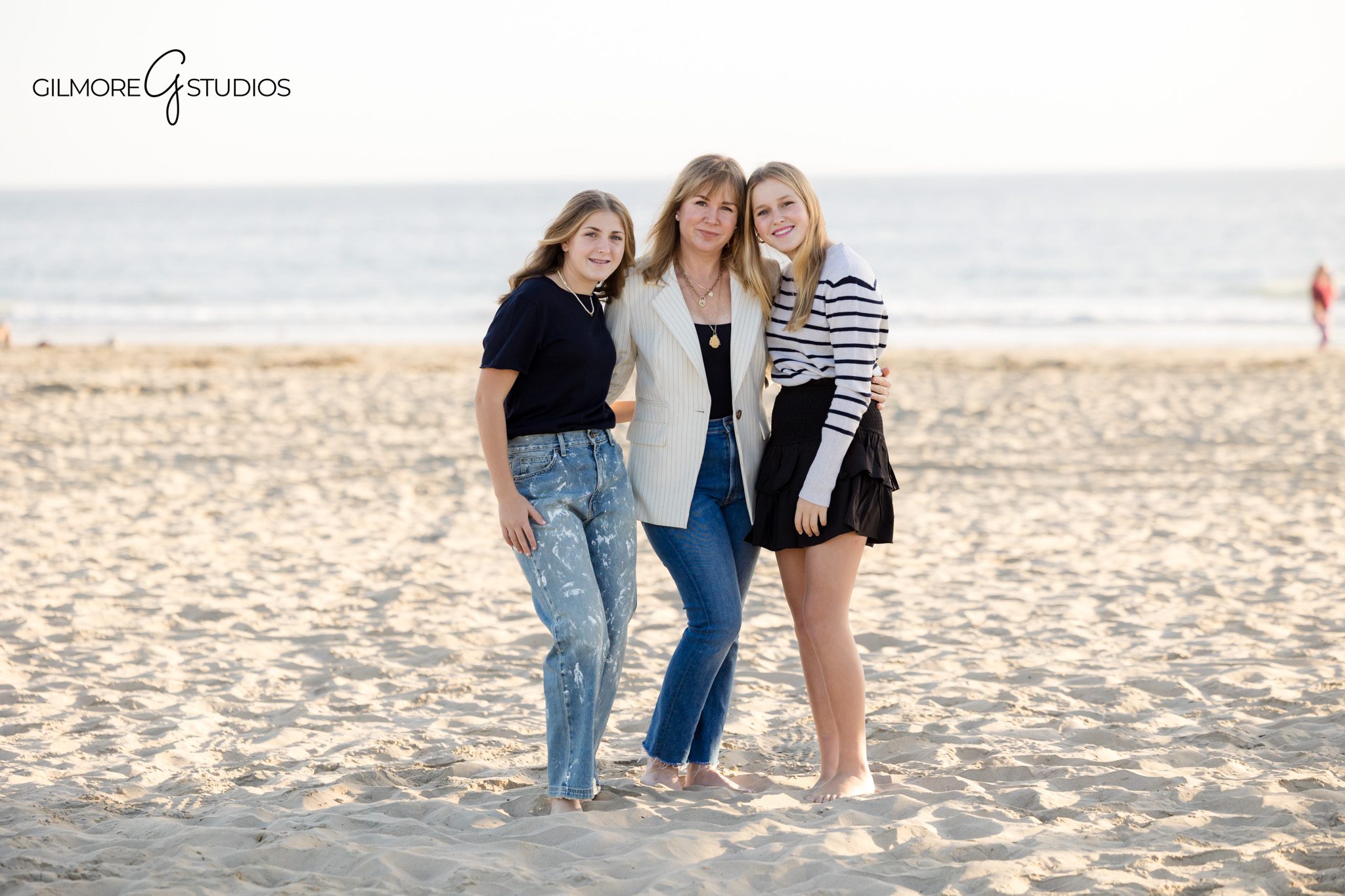 Beach family photography with teen girls photographed at Newport Pier
Teen family portrait photography session designed for timeless wall art