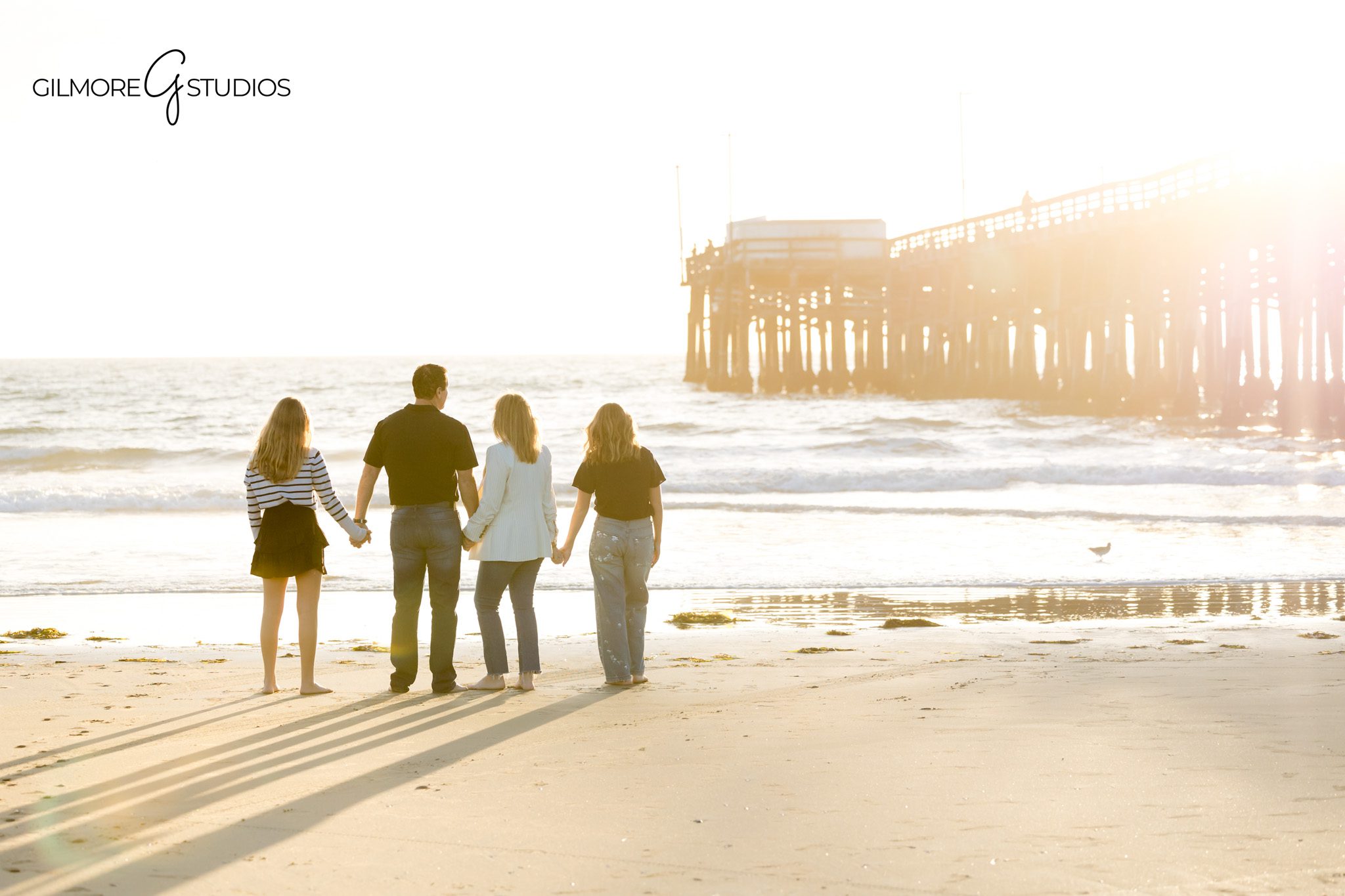 Teen family photography session with parents at Newport Pier
Family portrait photography Newport Beach with teen daughters