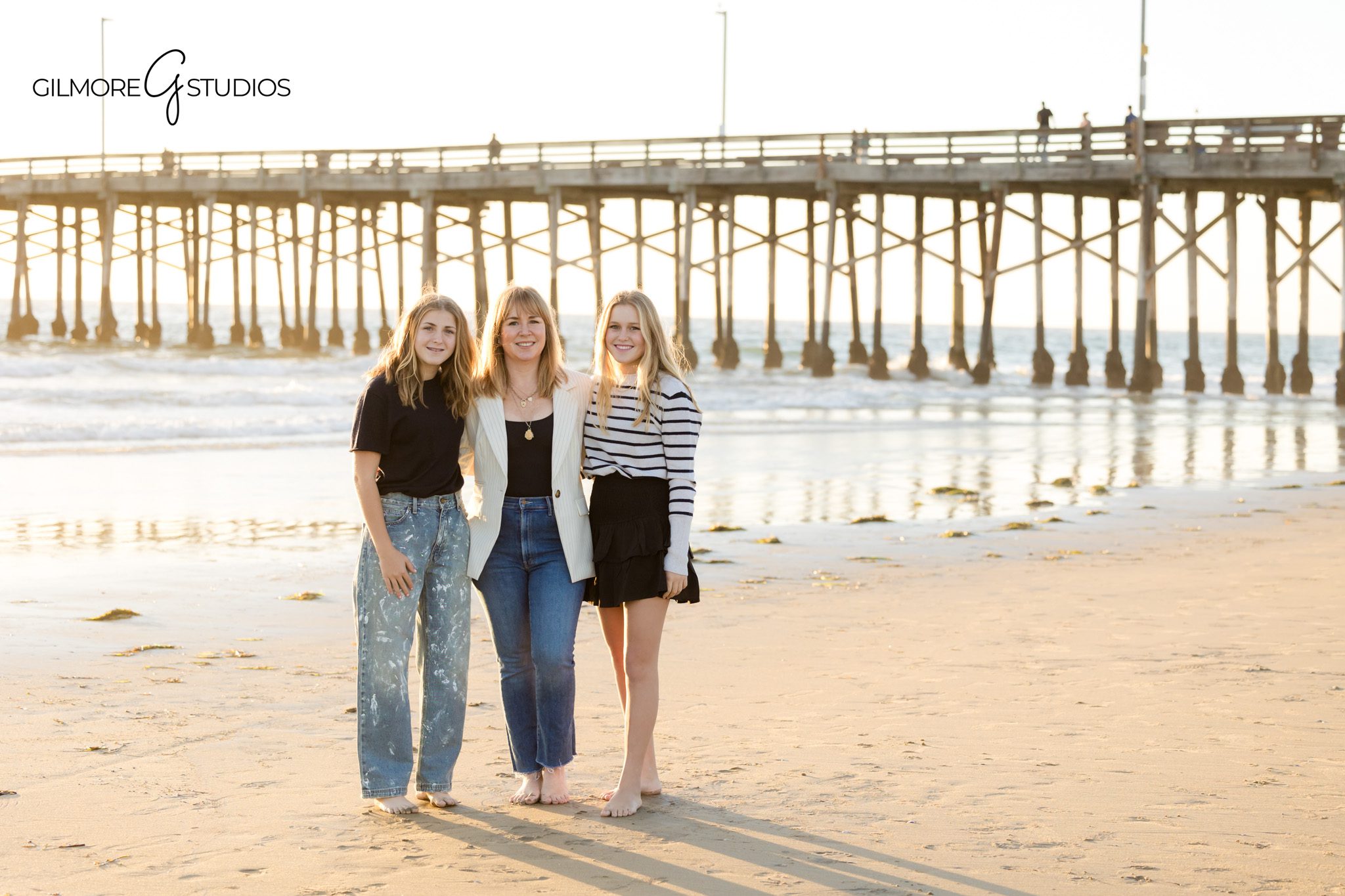 Family photography session with teenage daughters at Newport Pier
Teen family portrait photography captured with coastal light at Newport Pier
