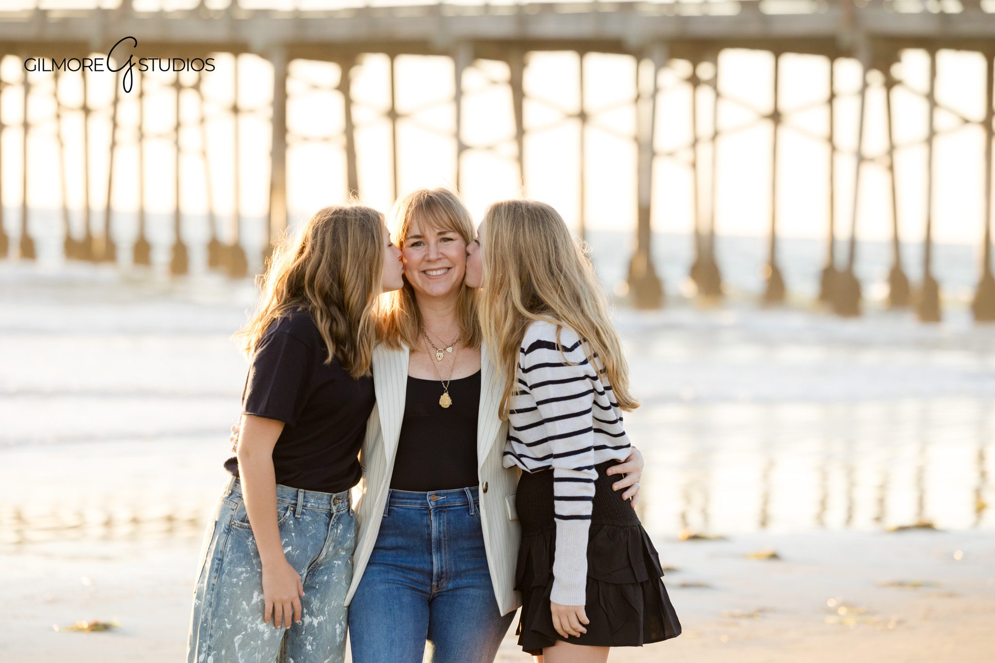 Newport Beach family photographer photographing teen girls during a beach session
Coastal family portrait photography with teens at Newport Pier