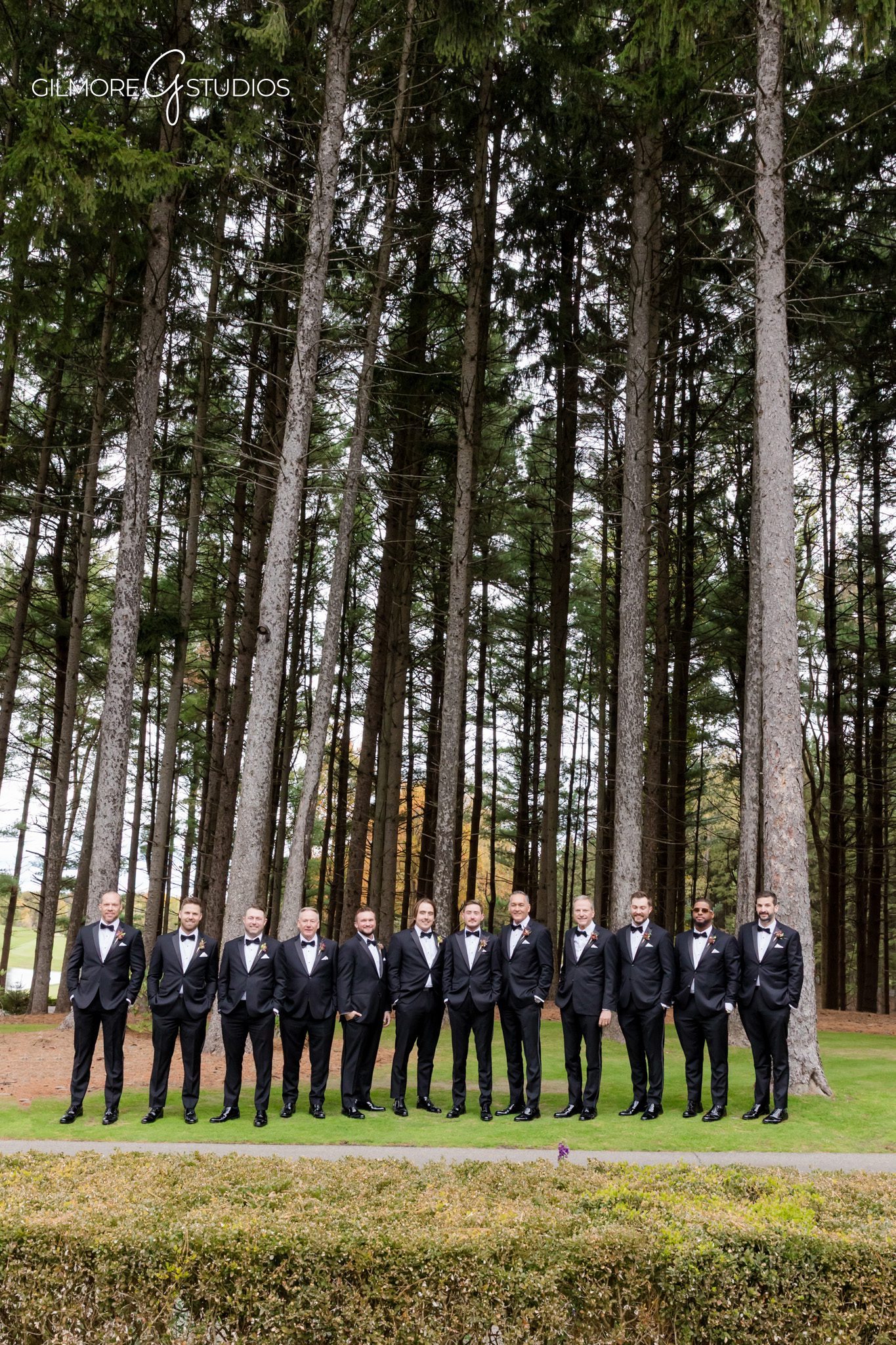 Photographer capturing couple’s candid laughter on wooded pathway.

Wedding photography showcasing elegant floral arch at Shepherd’s Hollow.