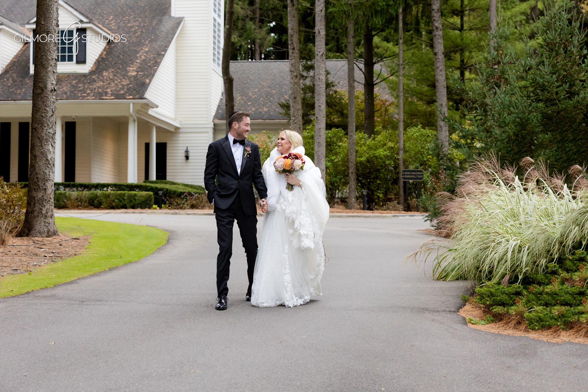 Michigan wedding photography showcasing lush green surroundings.

Bride and groom portrait photography near wooden bridge at venue.