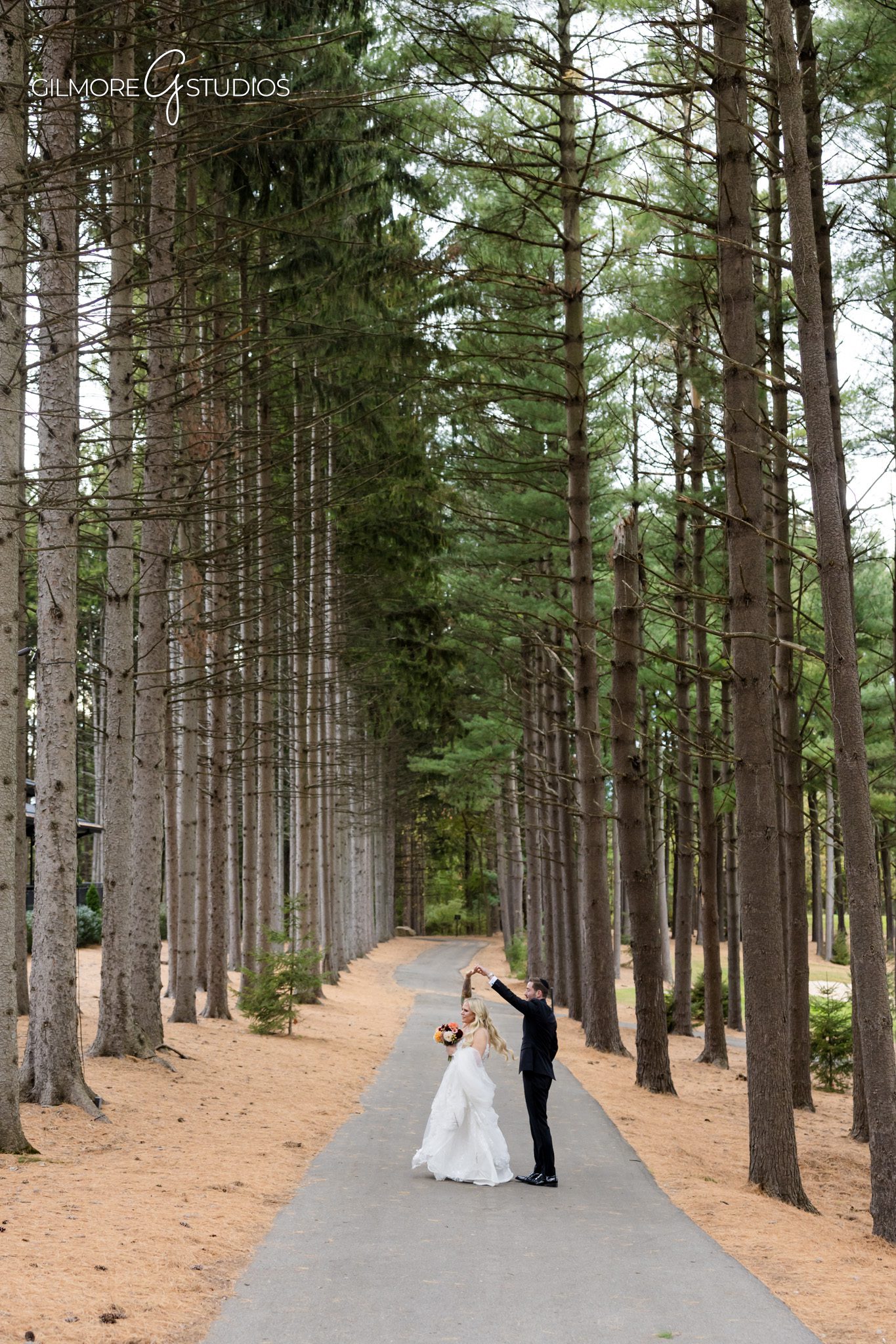 Destination photographer documenting quiet moment before ceremony.

Rustic elegant wedding photography in wooded Michigan setting.