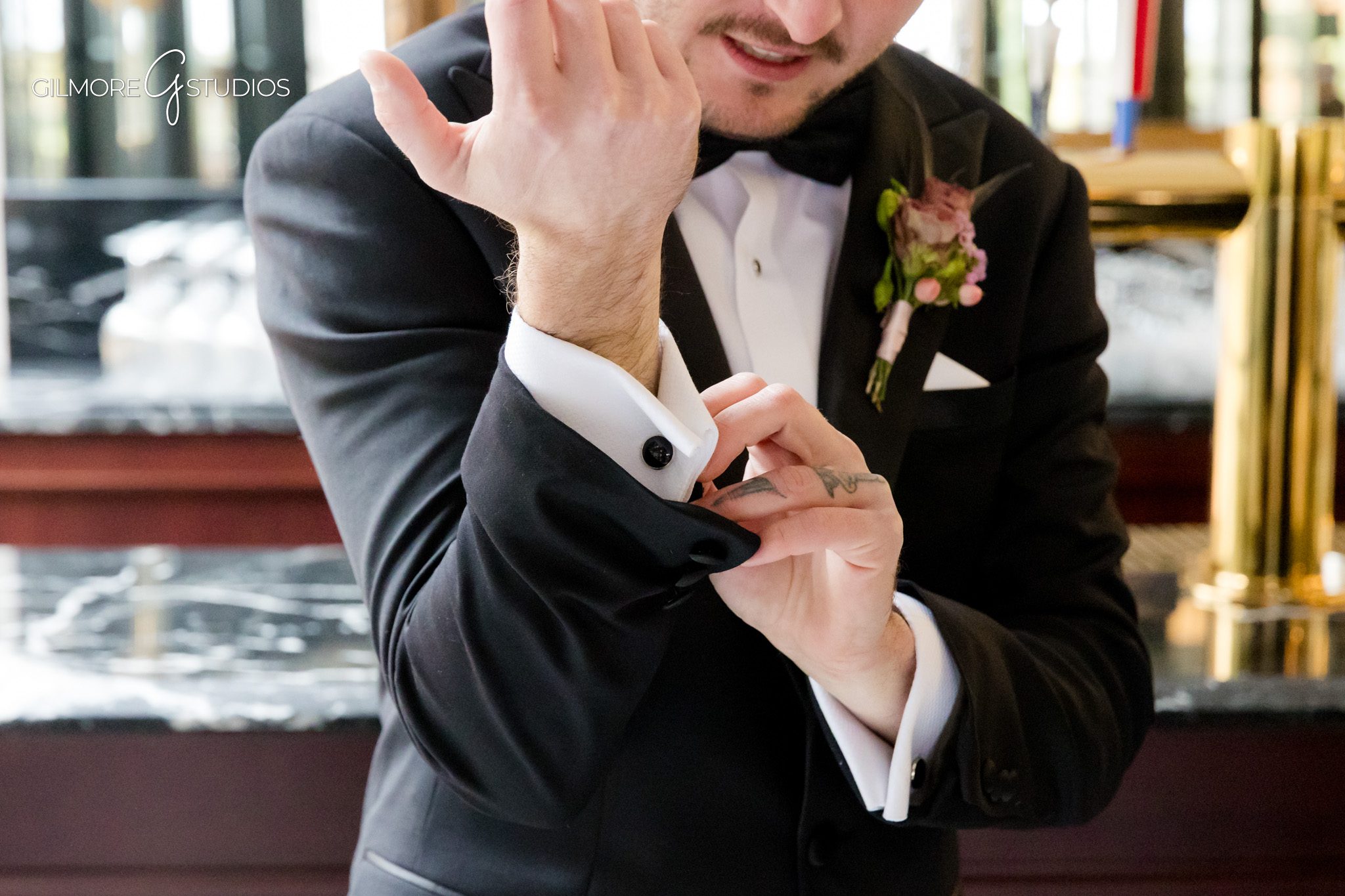 Ceremony photography showing couple exchanging rings beneath tall pines.

Michigan wedding portrait session featuring romantic forest setting.