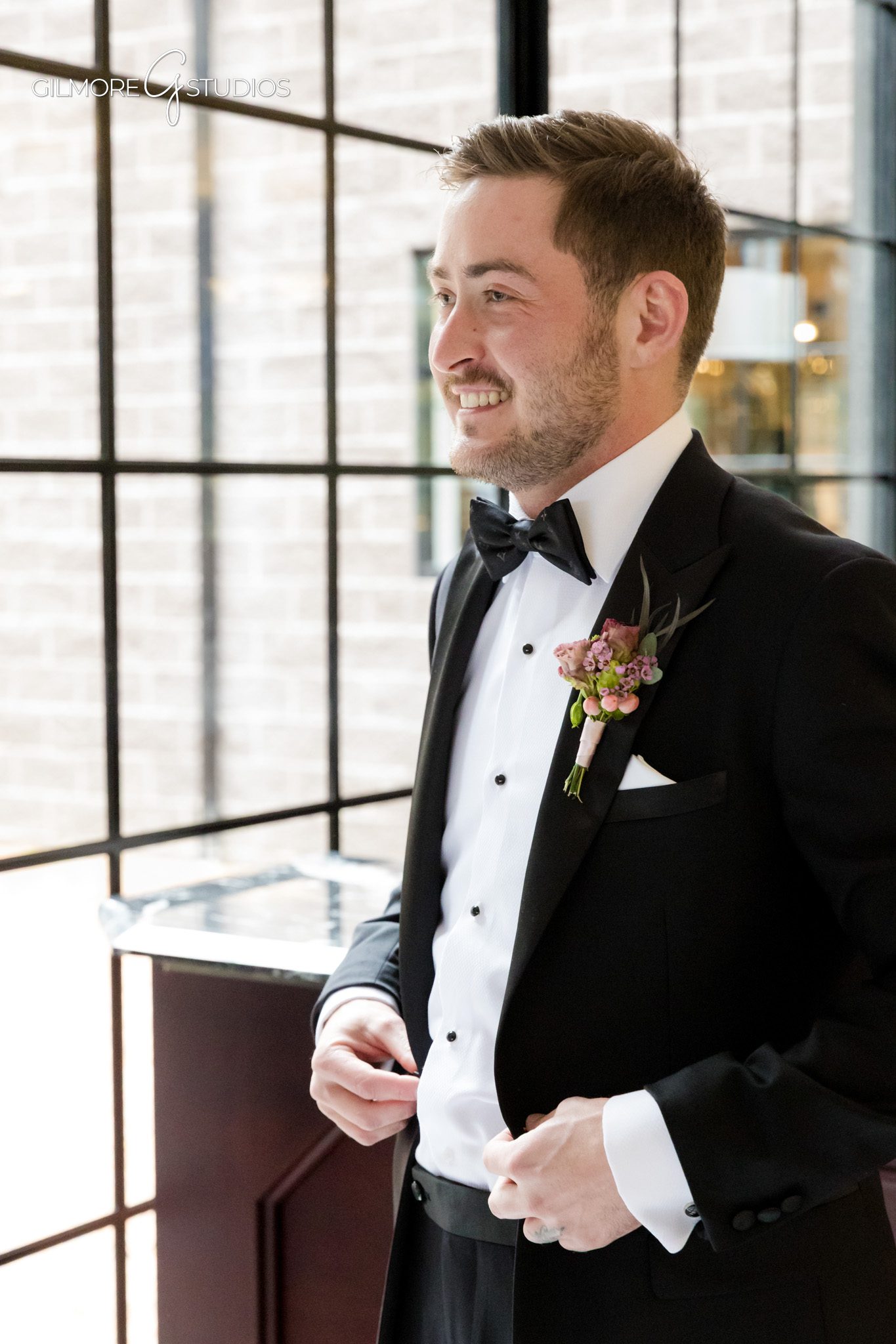 Groom portrait photographed at Shepherd’s Hollow Golf Club in natural light.

Wedding photographer capturing couple’s first look on forest pathway.