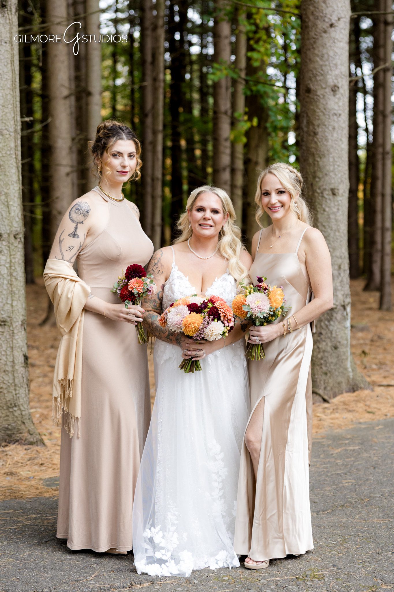 Bridal party portrait photography posed in tall pine forest.

Michigan destination photographer capturing timeless bridal elegance.