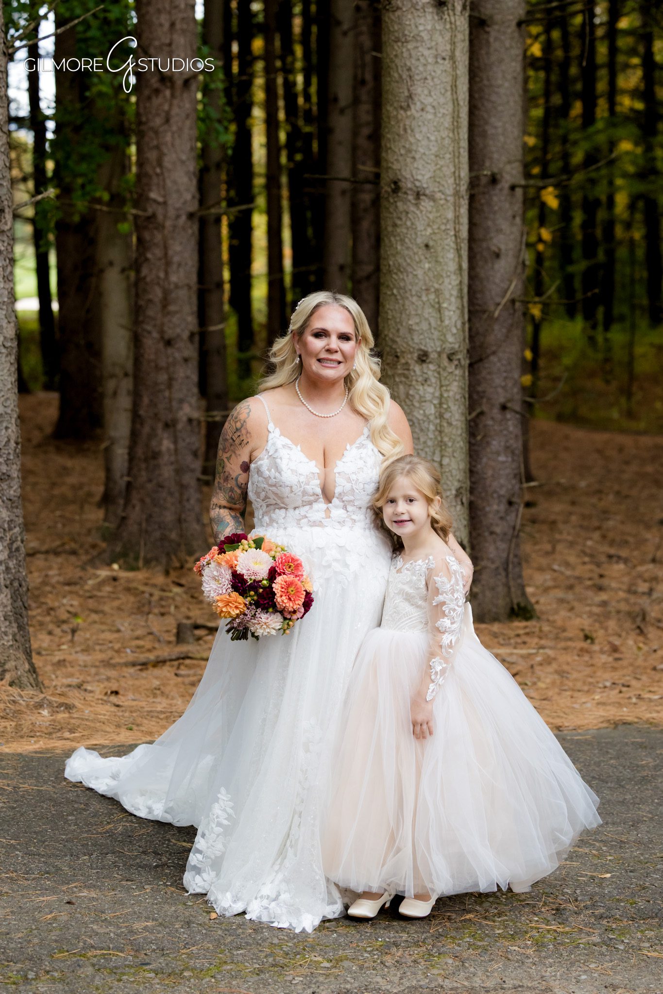Wedding photographer documenting cake cutting under soft lighting.

Michigan forest photography highlighting dramatic tree shadows.