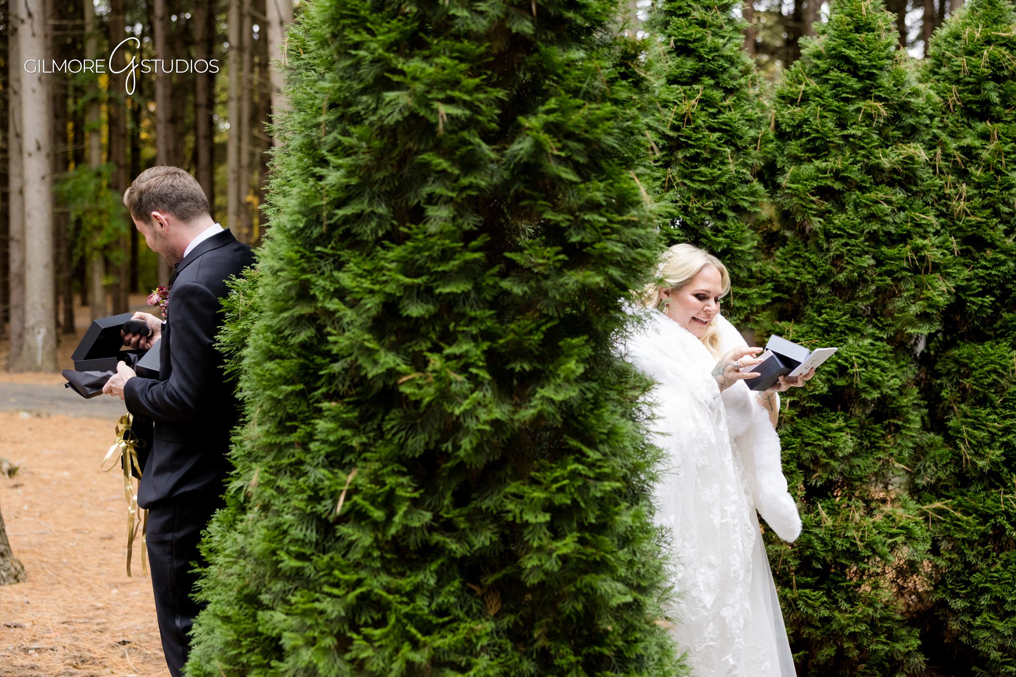Bridal portrait photography surrounded by tall Michigan pine trees.

Groom getting ready photographed at Shepherds Hollow wedding suite.