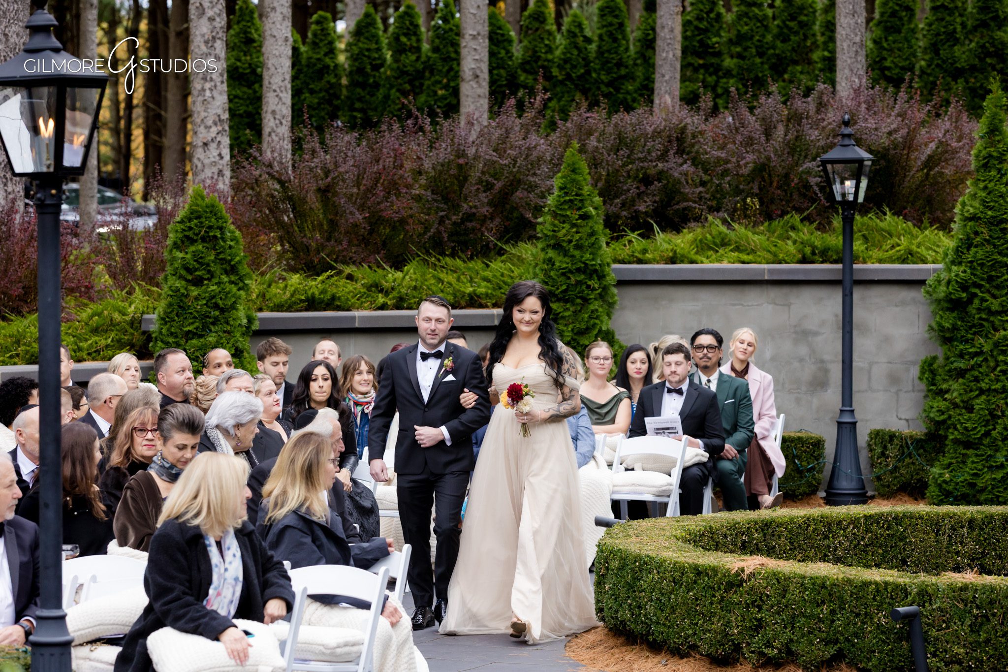 Groom portrait photographed against forest greenery.

Bride and bridesmaids photography at Michigan venue.