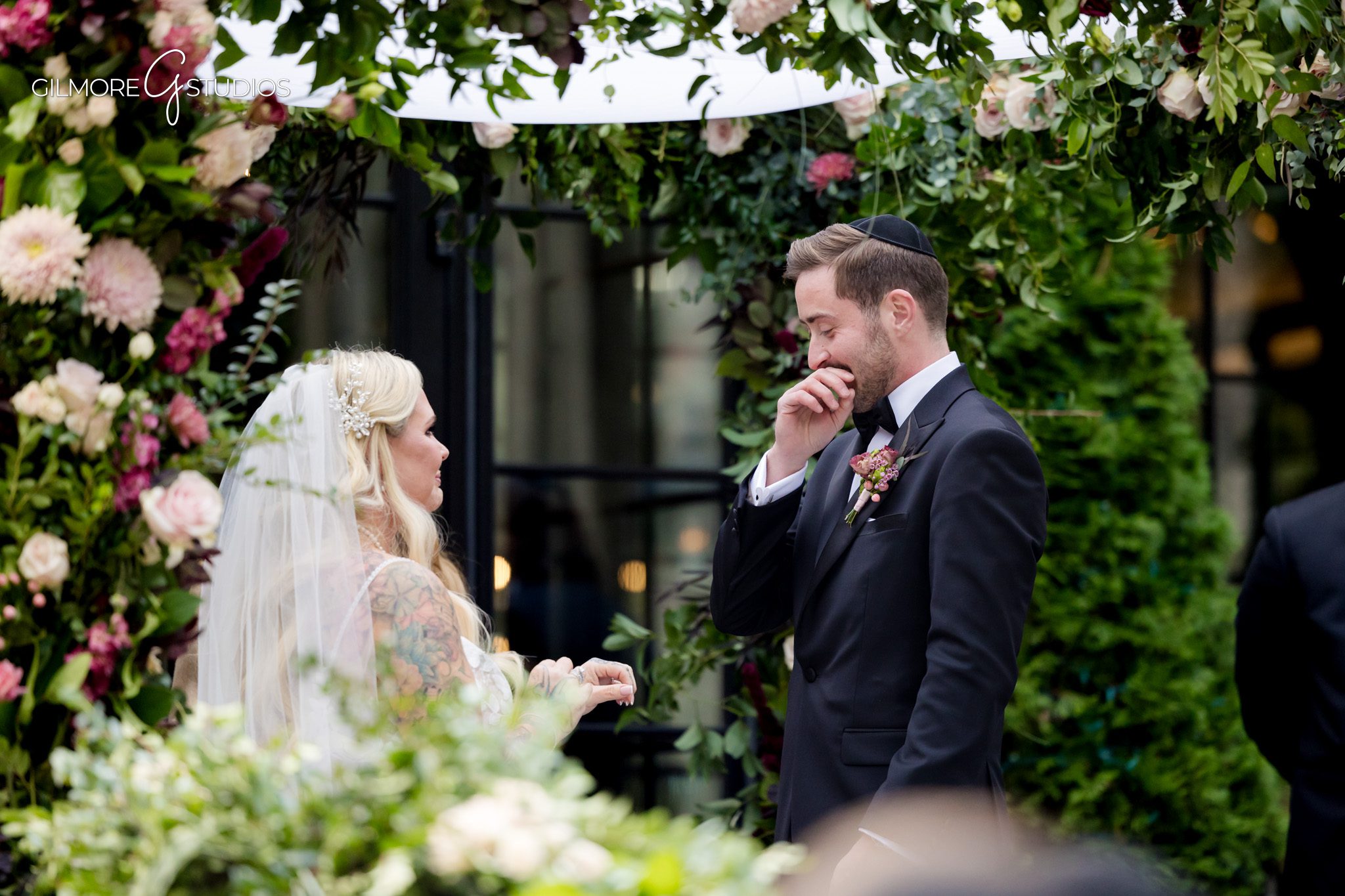 Elegant rings photographed by wedding photographer in Michigan.

Bride and groom’s first dance photographed at reception.