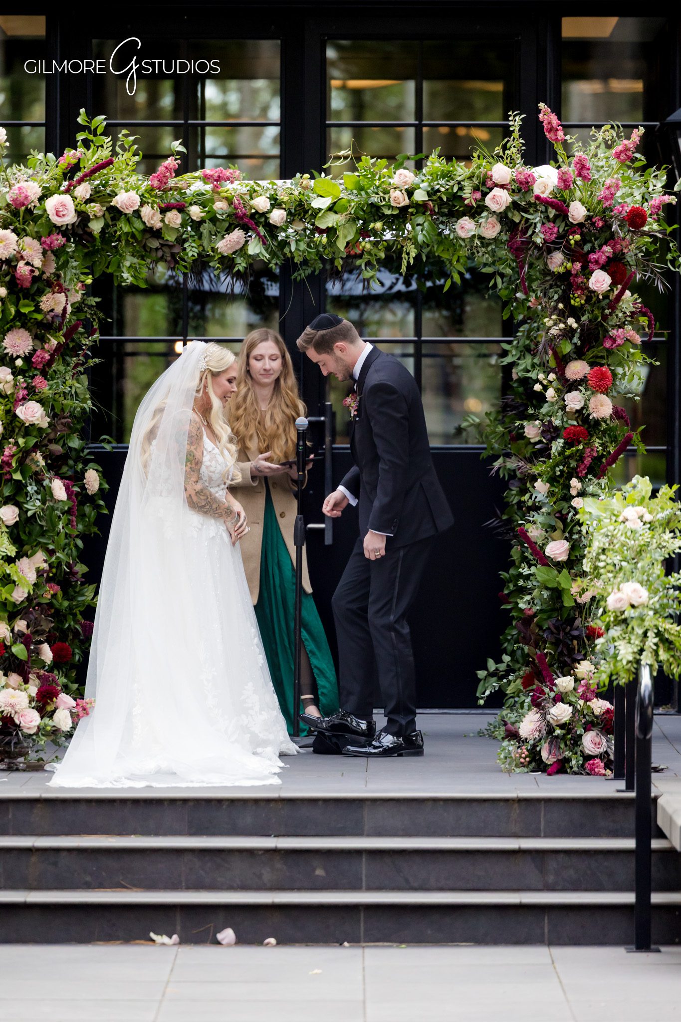 Detail photography of table settings at Shepherds Hollow reception.

Michigan wedding photographer shooting ceremony kiss.