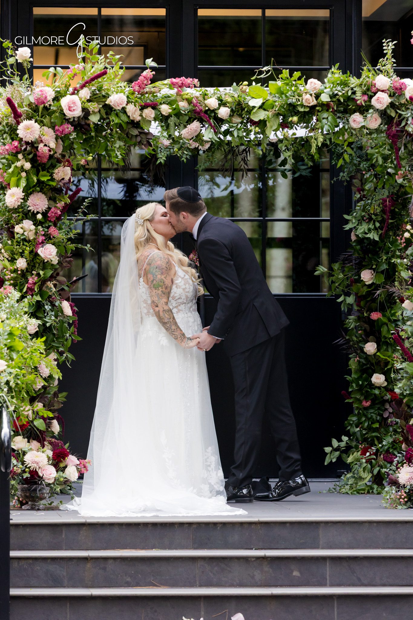 Candid photography of bride adjusting veil before ceremony.

Groom reaction portrait captured during first look.