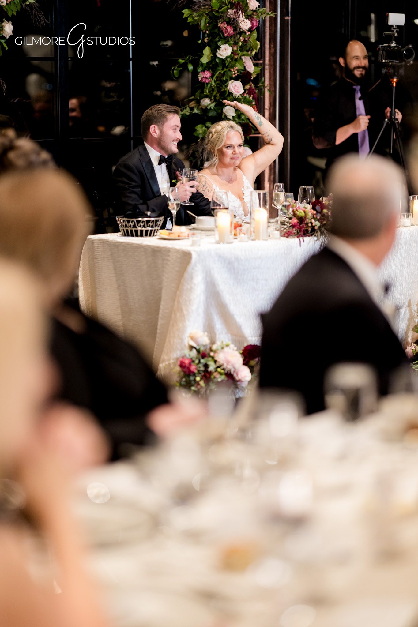 Bride and groom portrait photography by modern glass windows.

Michigan photographer capturing candid wedding party fun.