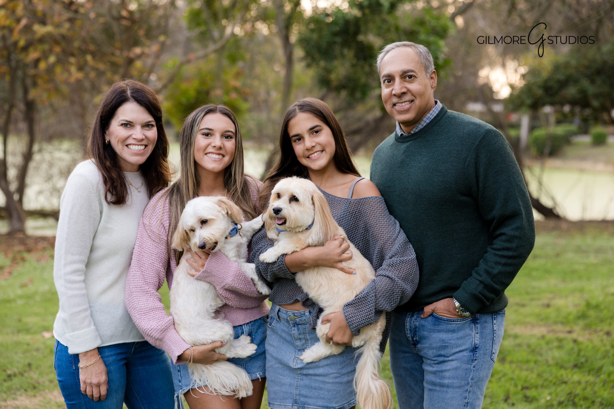 Huntington Beach photographer capturing playful family moment at library grounds.

Family photography showing parents walking with kids near HB Central Library.