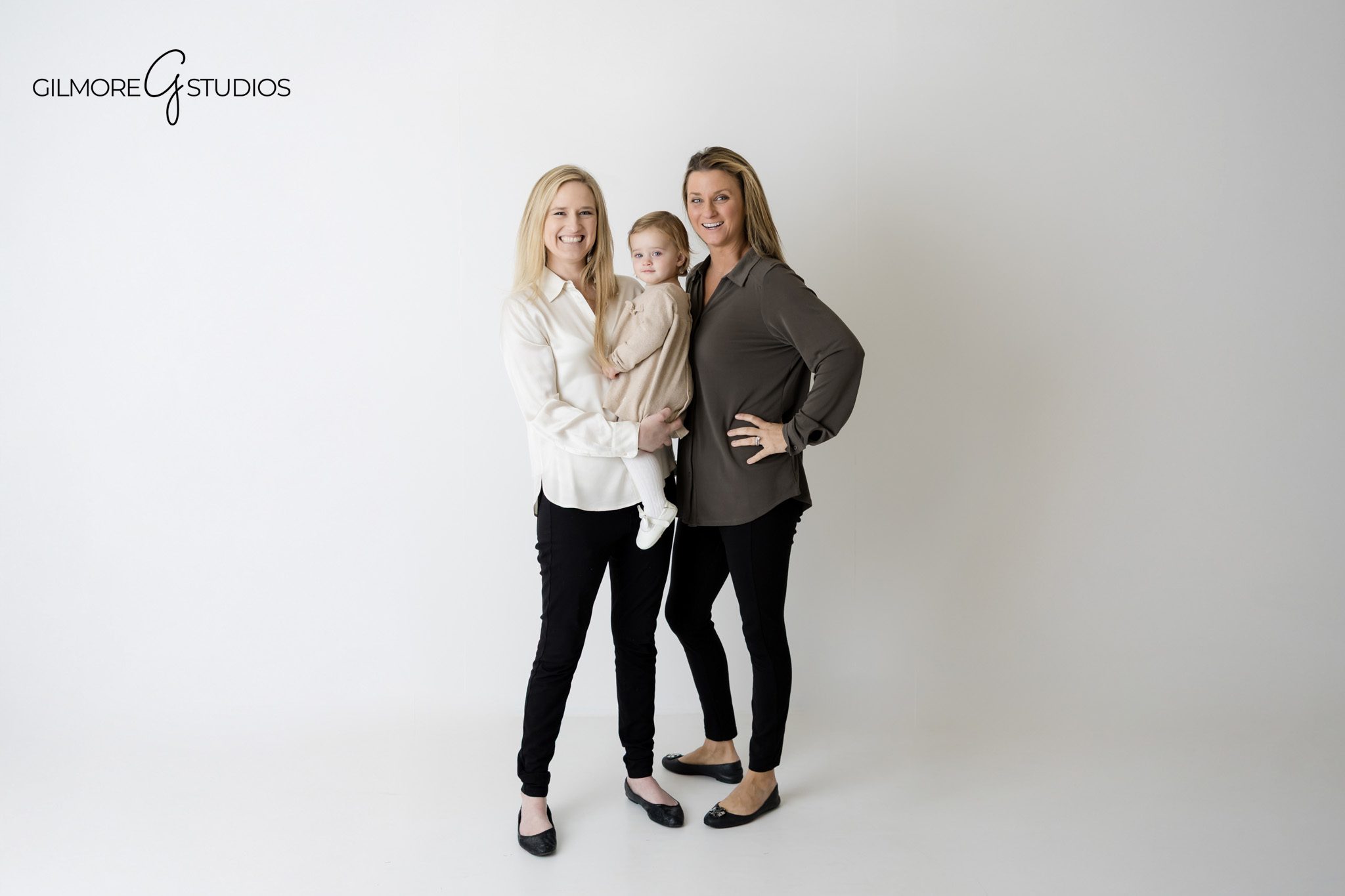 Gilmore Studios family photography with bright white portrait style.

Studio portrait photography capturing formal family look on white background.