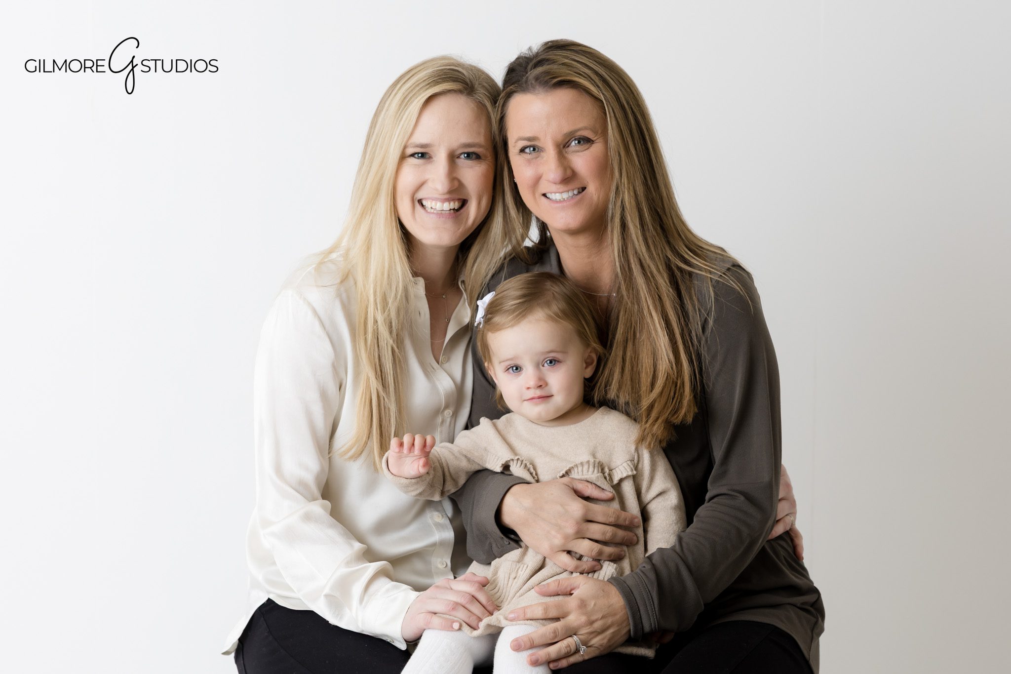 Family portrait photography on white background with Orange County photographer.

Studio family photographer capturing clean white backdrop portraits.