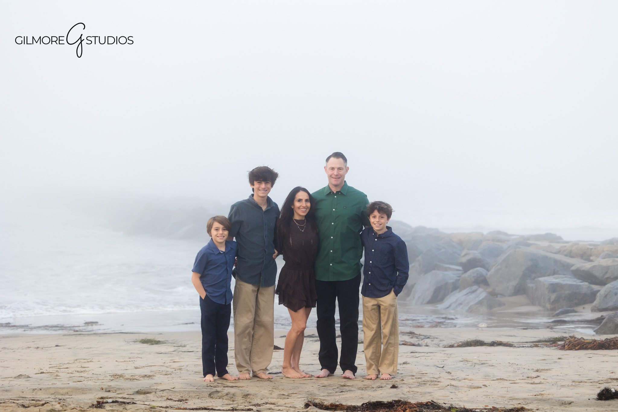 Foggy beach family photography session with Orange County photographer.

Family portraits captured on a foggy shoreline by Newport Beach photographer.
