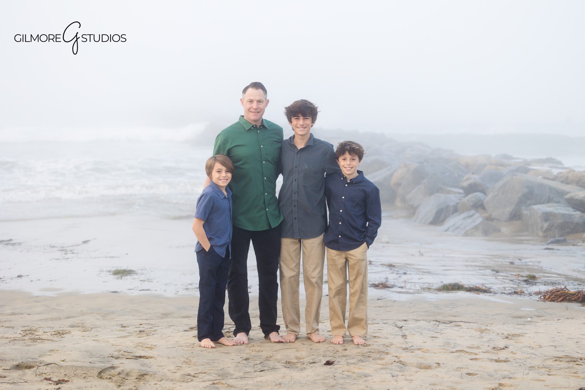 Natural light photographer capturing hazy beach family portraits.

Lifestyle family photography in coastal fog at Newport Beach.