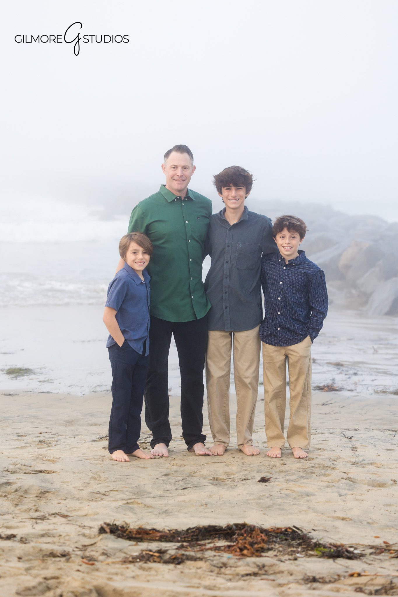 Newport Beach photographer capturing soft foggy family photos.

Dreamy family portrait photography on misty beach morning.