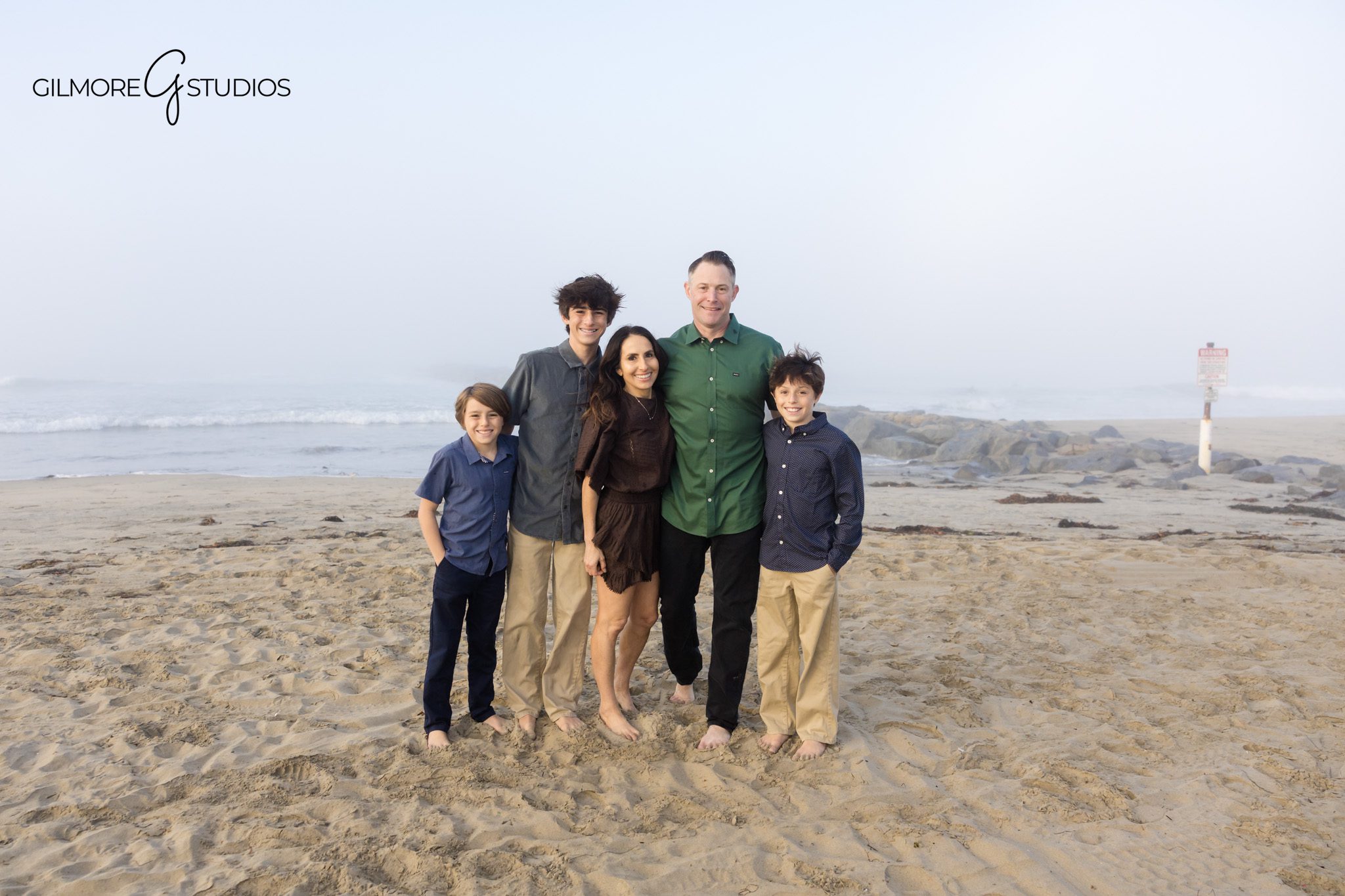 Family photography in thick coastal fog for soft aesthetic.

Fog-blanketed beach portraits by Southern California photographer.