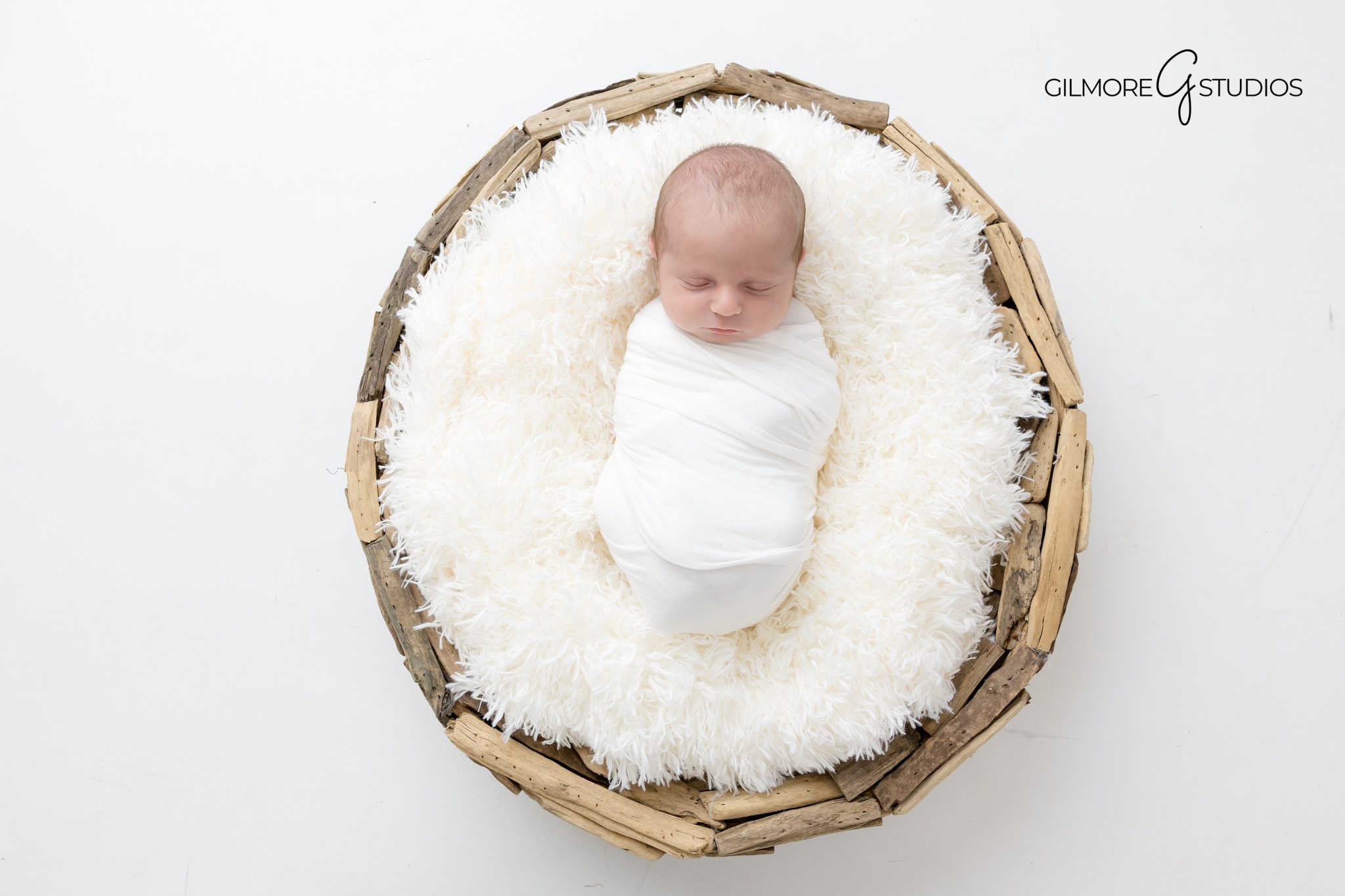 East Valley newborn portrait photography with warm light.

Newborn photographer capturing newborn expressions in studio.