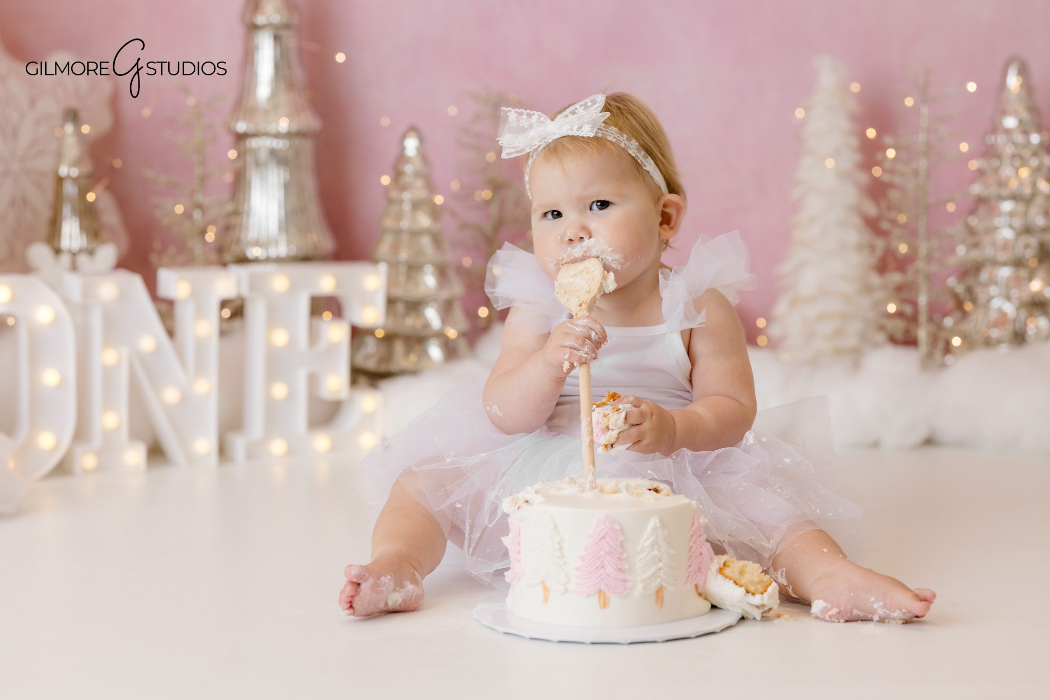 Winter cake smash portrait session captured in a styled indoor photography studio

Newport Beach baby portrait photography featuring snow theme cake smash