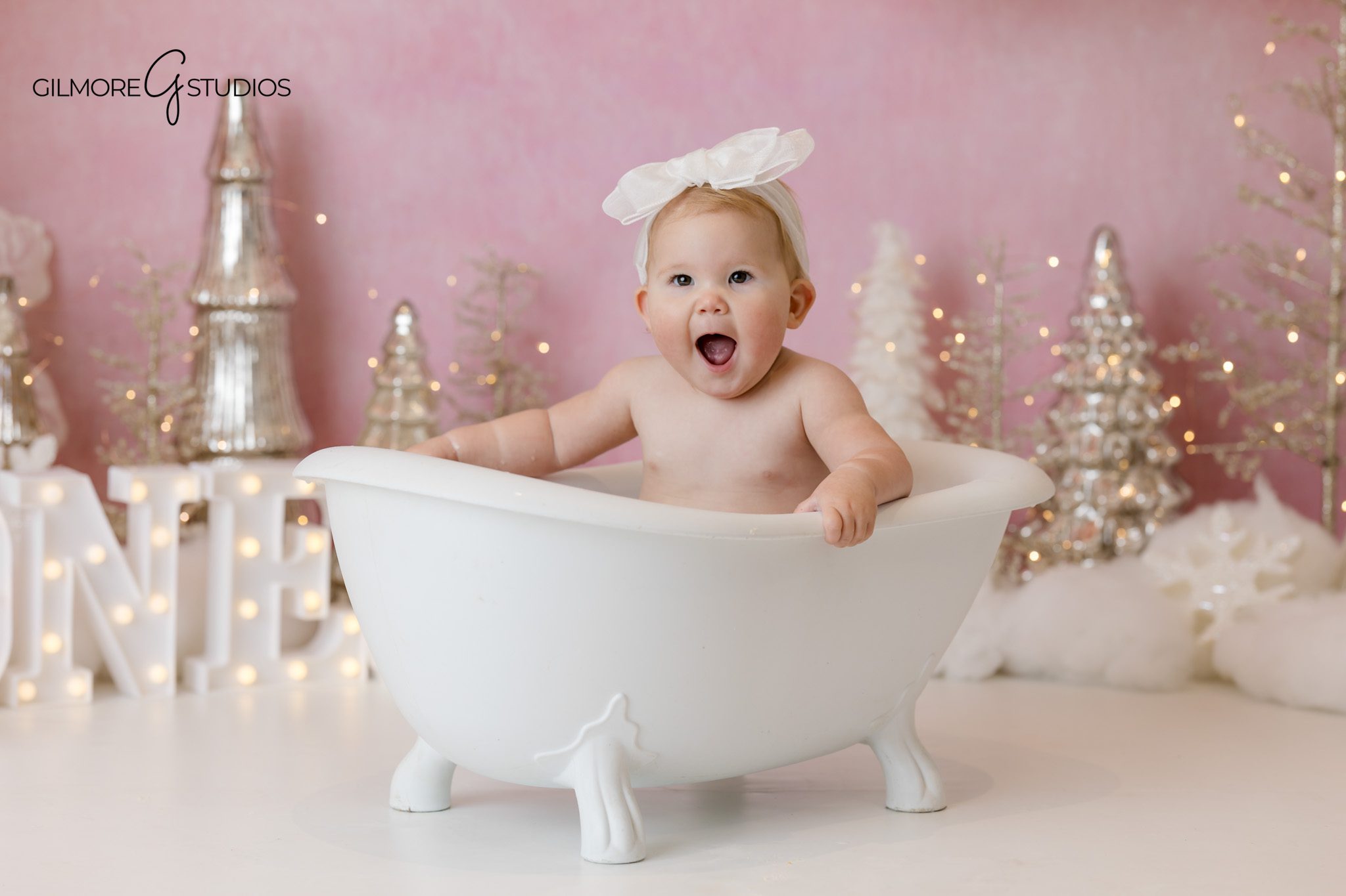 Newport Beach first birthday photography session with Winter Wonderland theme

Baby portrait photography session featuring snow inspired cake smash styling