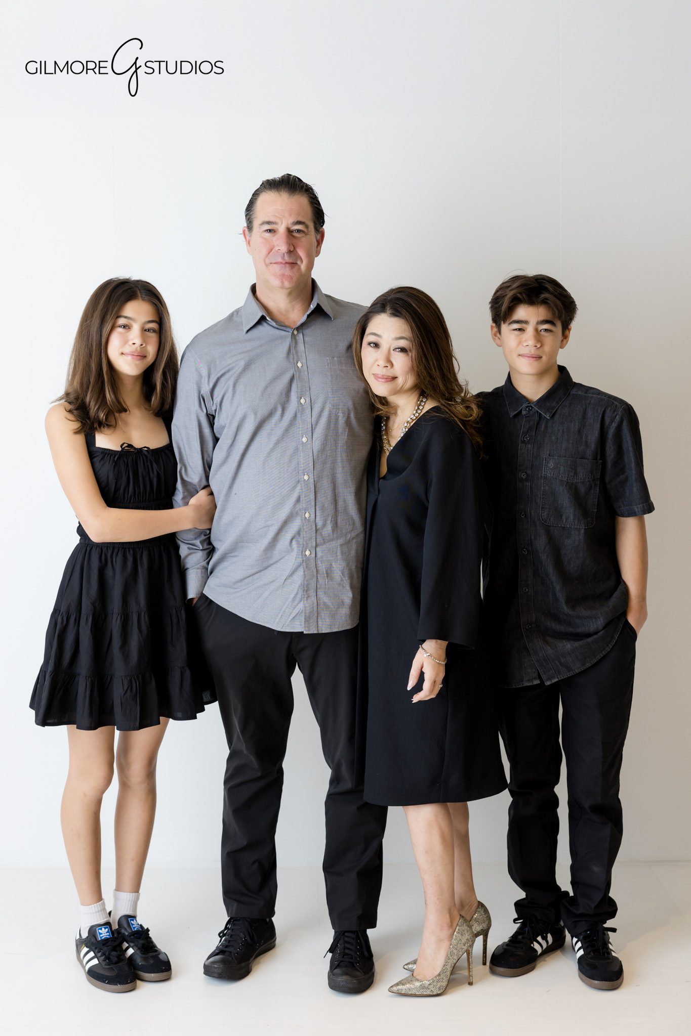 White background family photoshoot capturing timeless family portraits

Family portrait photography on a white background in a studio setting