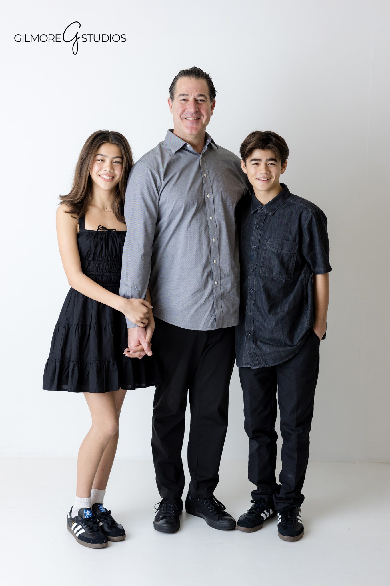 White background family photos captured by a professional portrait photographer

Studio family photography with neutral styling and white backdrop