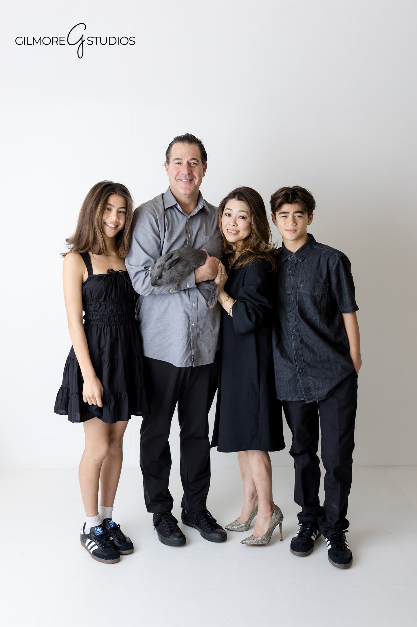 White studio family portrait photographed by an experienced family photographer

Studio family photography session with clean white backdrop