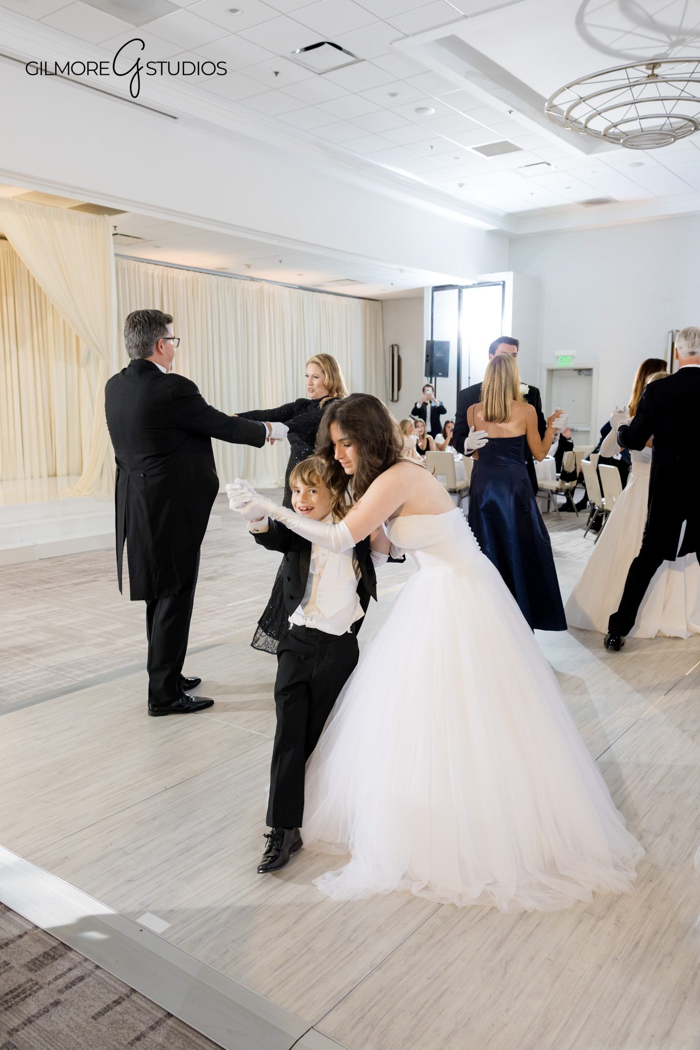 NCL event photography capturing debutante presentation on stage

Formal portrait photography from an NCL debutante ball