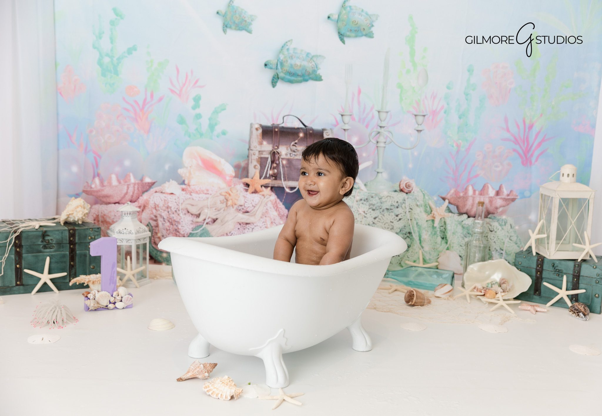 Indoor cake smash photographer Orange County with mermaid backdrop

Baby girl under the sea themed cake smash photography Orange County