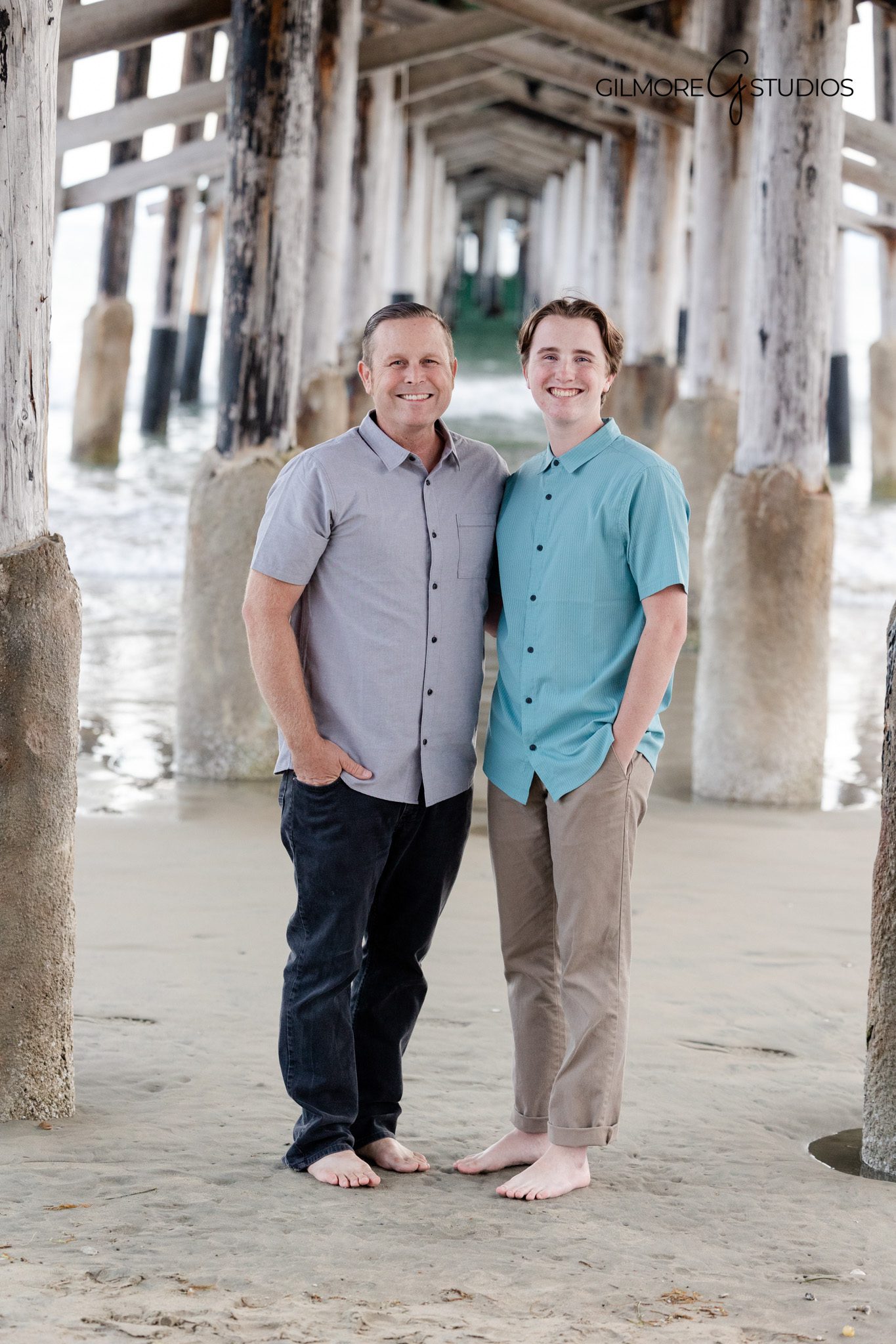 Newport Beach Pier family photographer capturing playful child expressions
Family portrait photography on the pier with natural posing