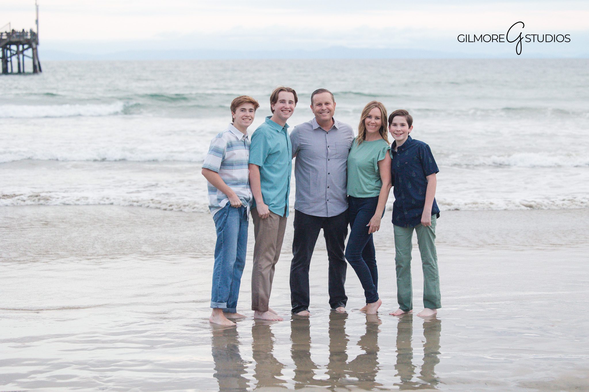 Newport Beach Pier family portrait photography with soft ocean tones
Family photography at the pier featuring movement and connection