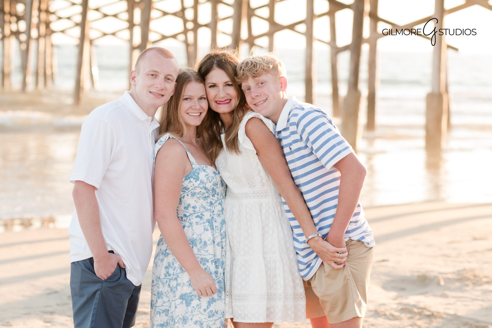 Newport Beach family portrait photography with ocean inspired tones
Family photography at the pier featuring natural movement and connection