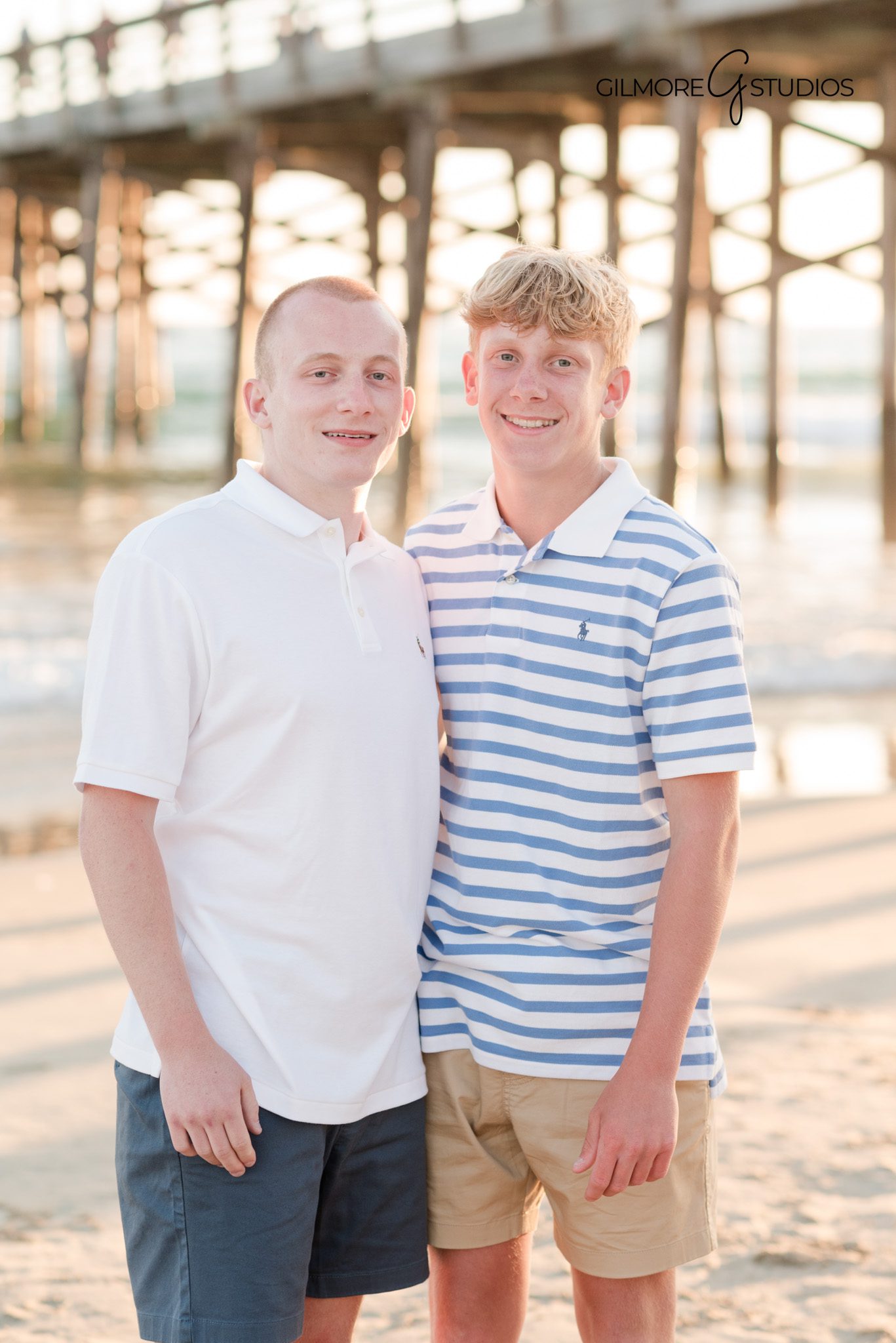 Professional family photographer capturing pier family portraits
Newport Beach pier family photography with ocean and sky backdrops