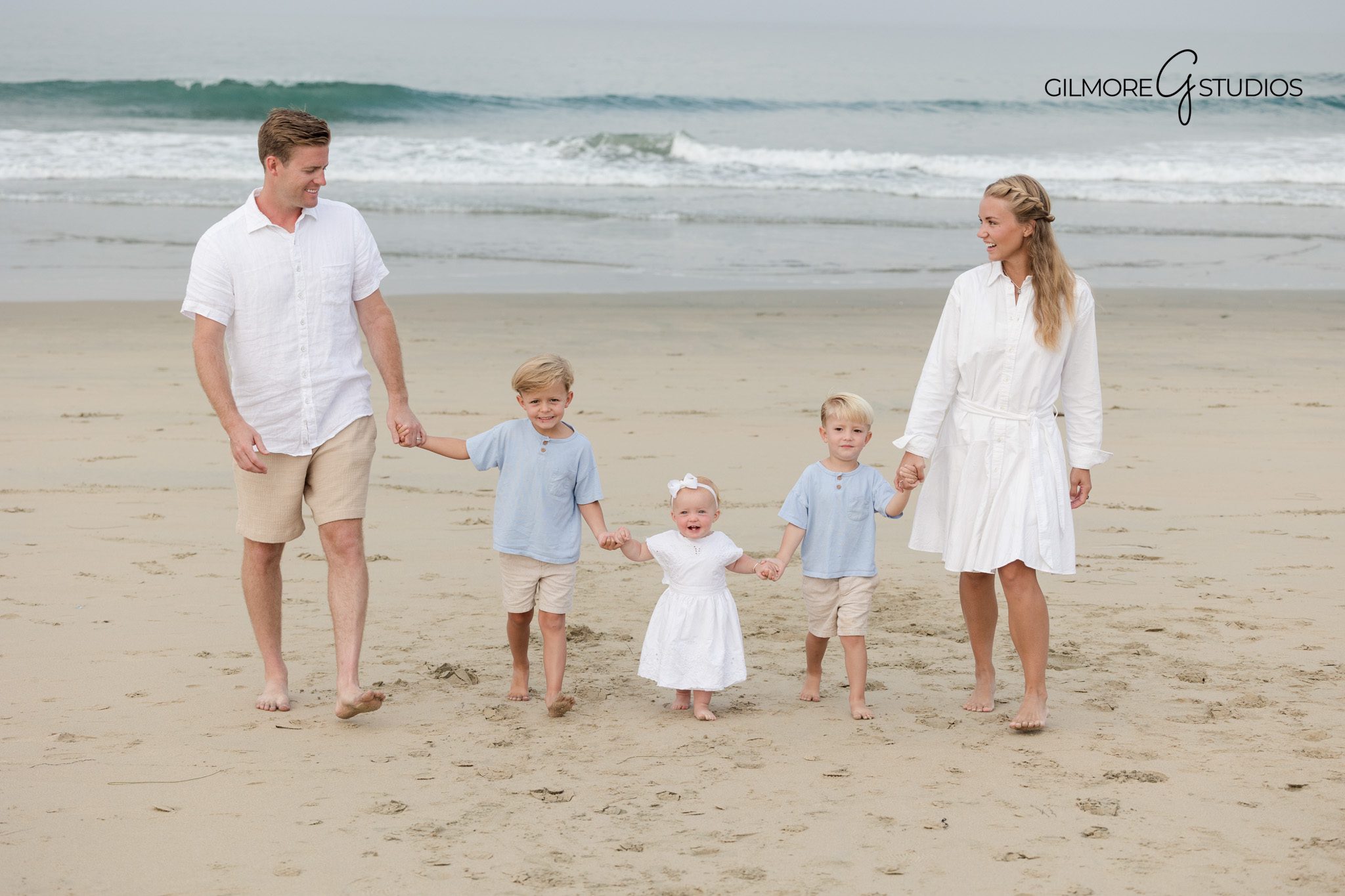 Professional family photographer capturing beach pier extended family portraits

Newport Beach pier extended family photography with natural expression