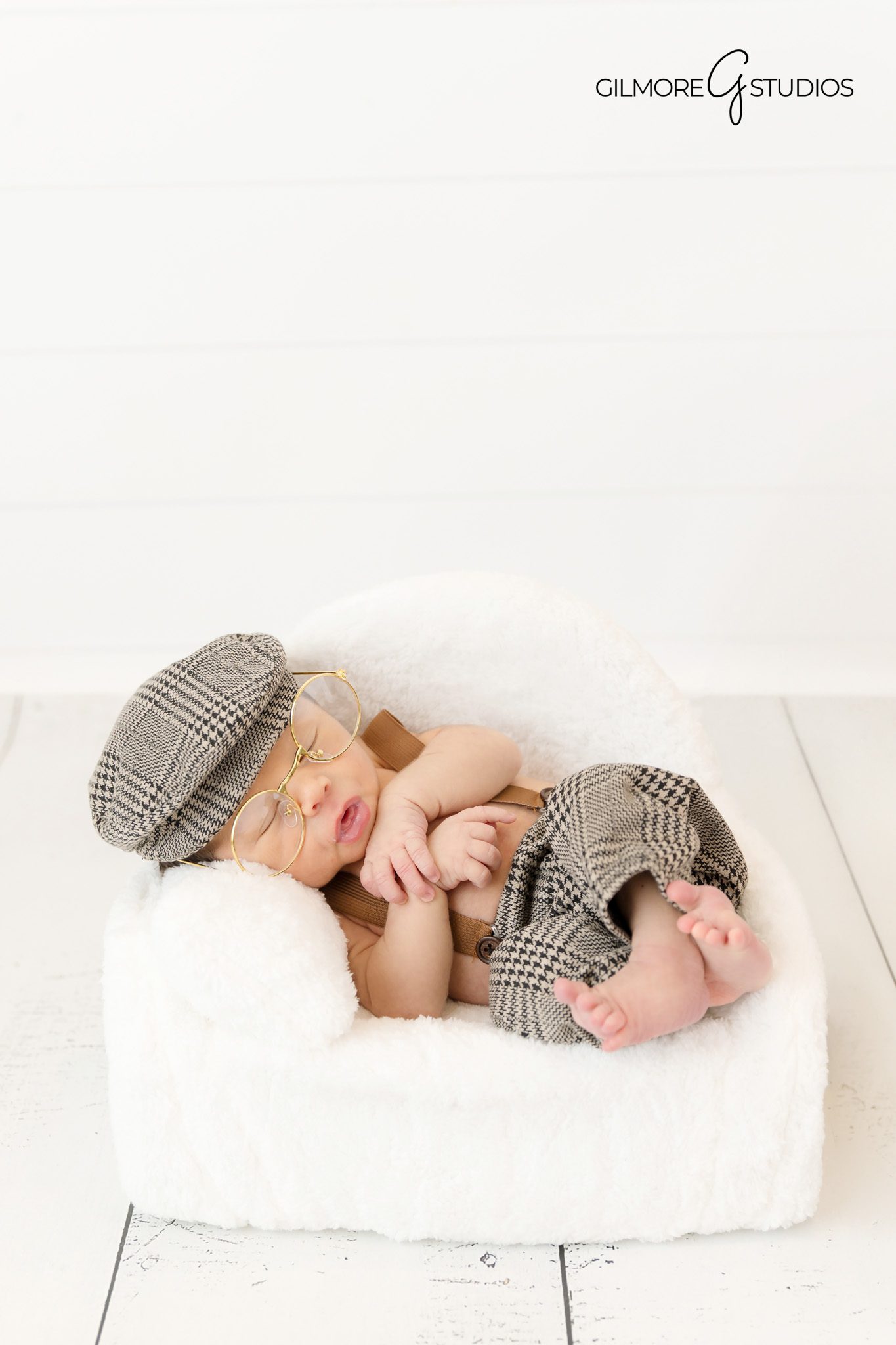 Newborn photography styled for winter
Newborn baby photographed peacefully with winter props