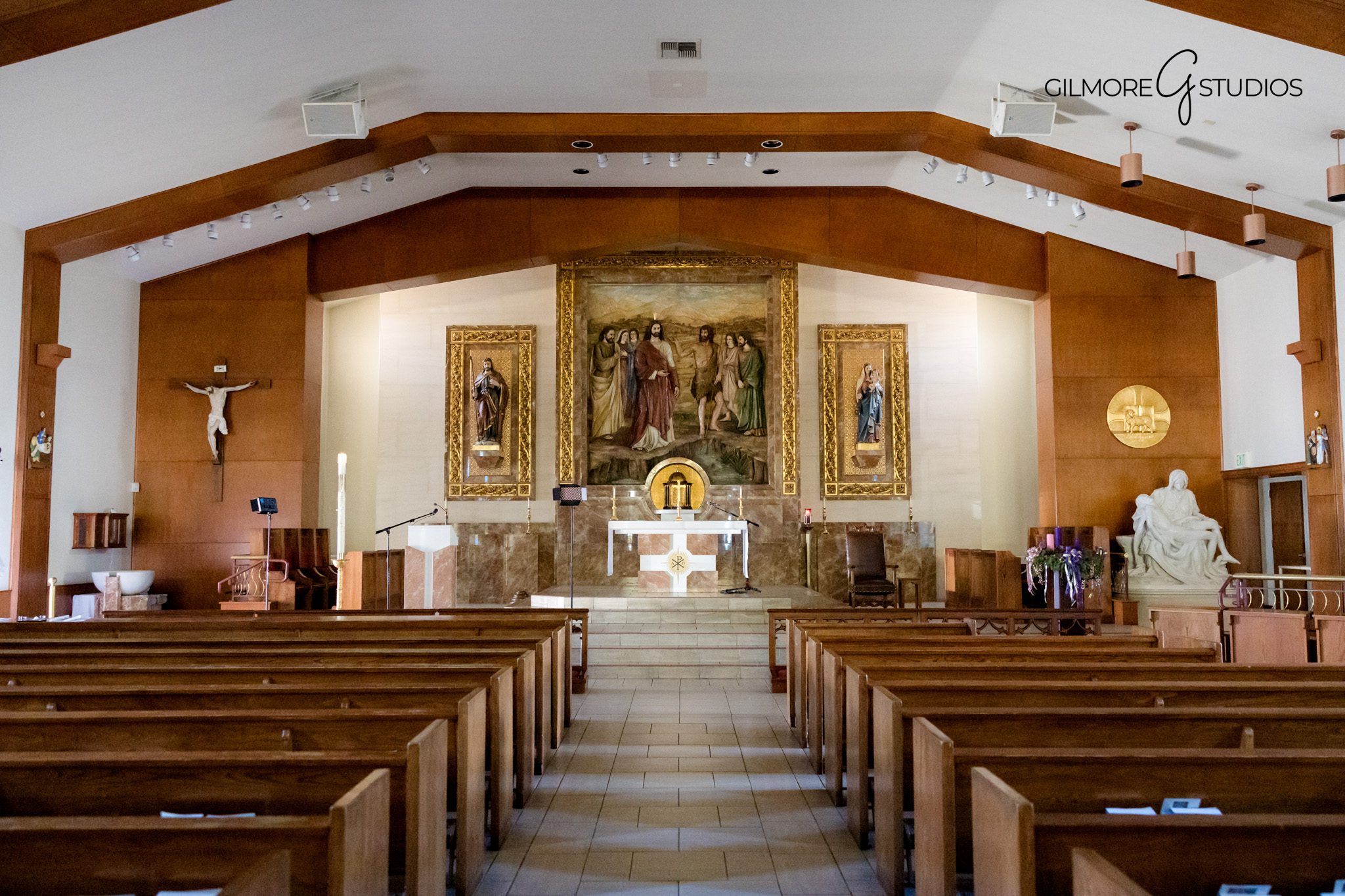 Professional baptism photography session during a Catholic service

Baptism portrait photography featuring parents and godparents