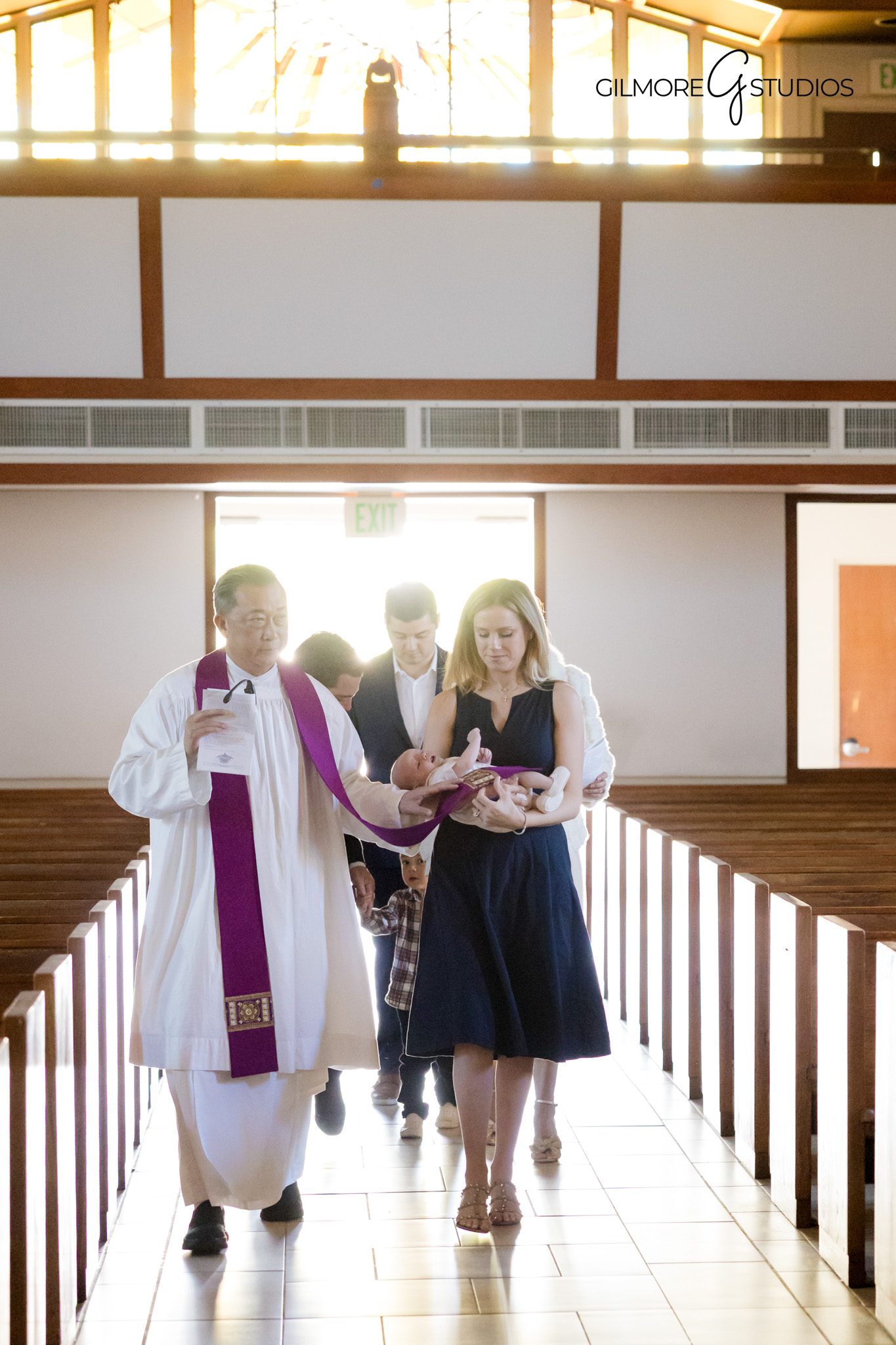 Baptism portrait photography showcasing faith and family connection

Newport Beach baptism photography session inside a Catholic church