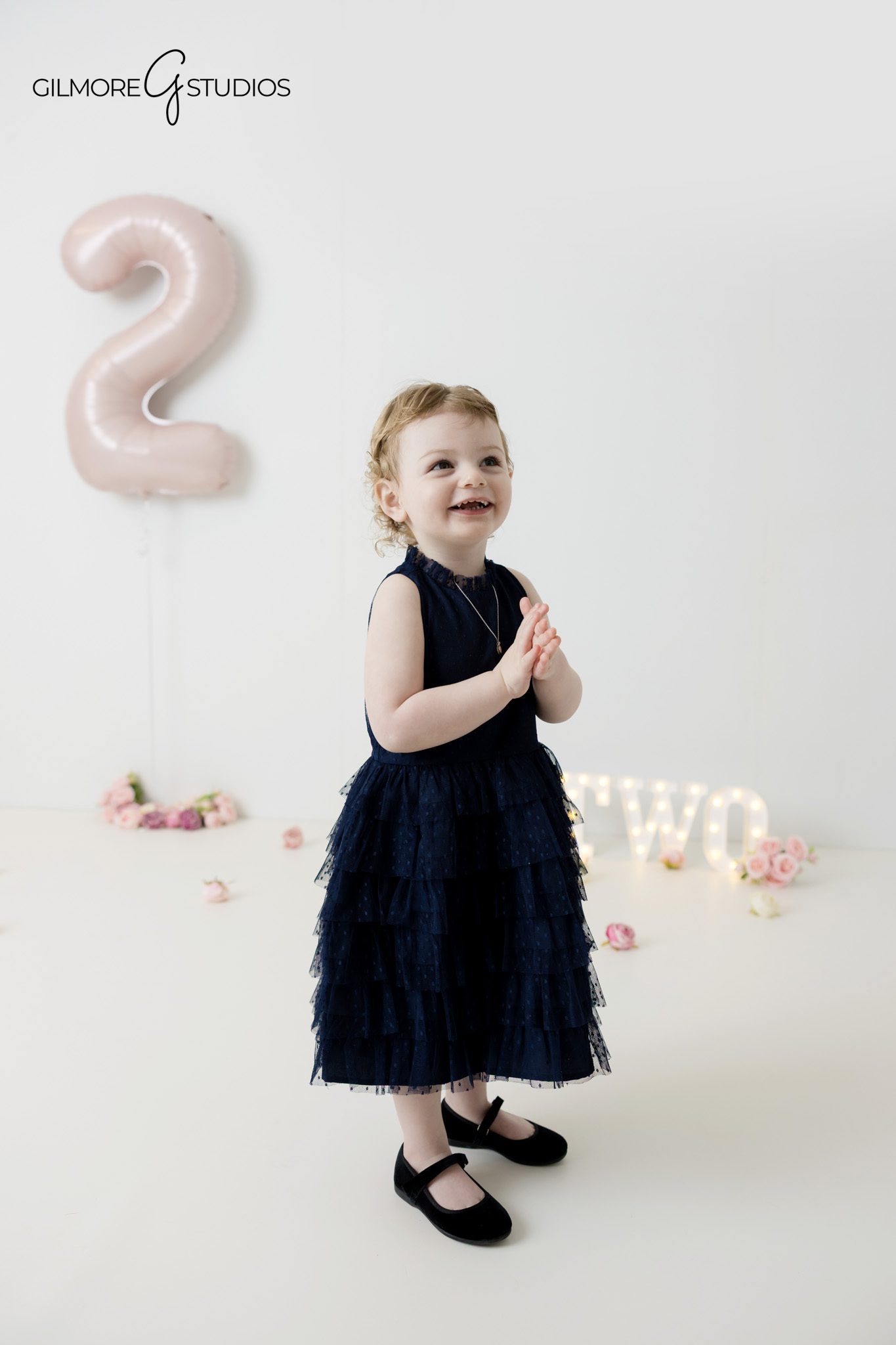 Toddler dancing freely during a candid family photo session with music playing
Mom laughing with her child during a relaxed lifestyle family photo shoot