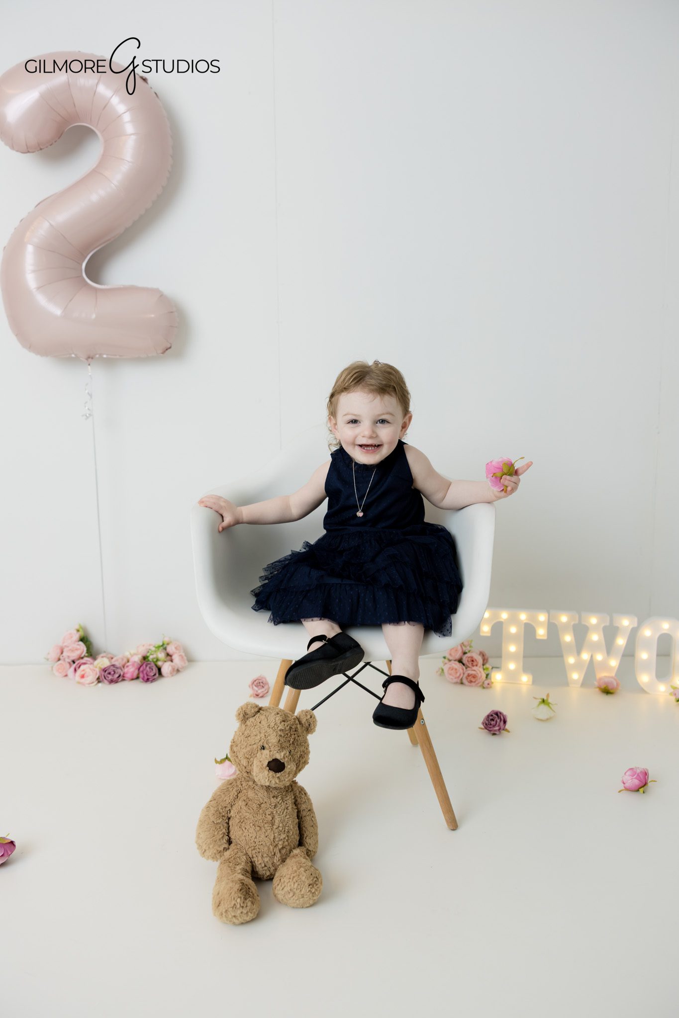 Child enjoying a family photography session
Parents and child spending time together