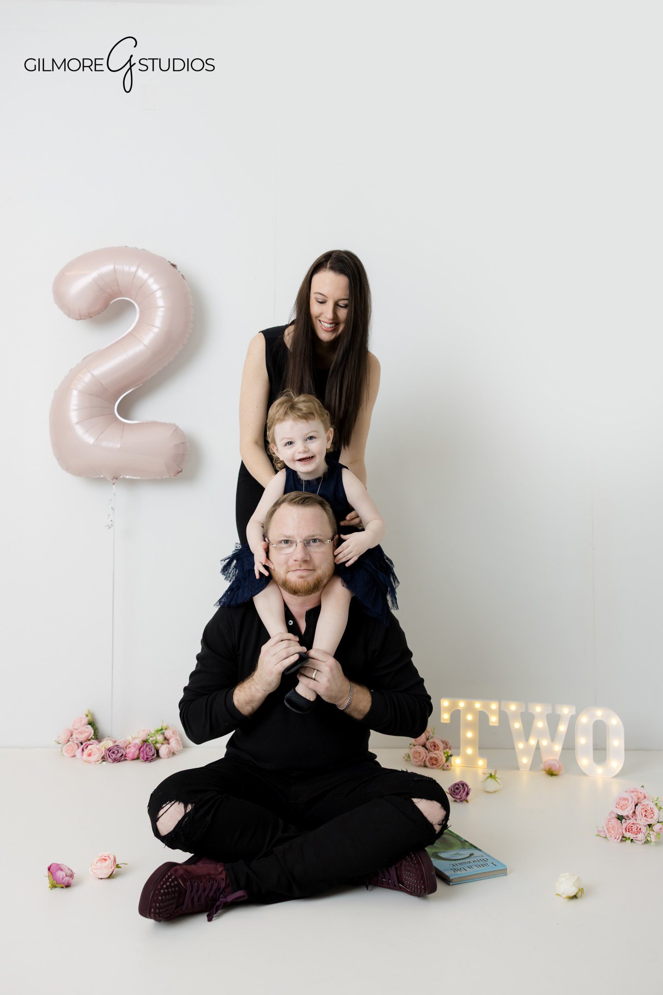 Child interacting with parents during a photo session
Family captured in an unstaged moment